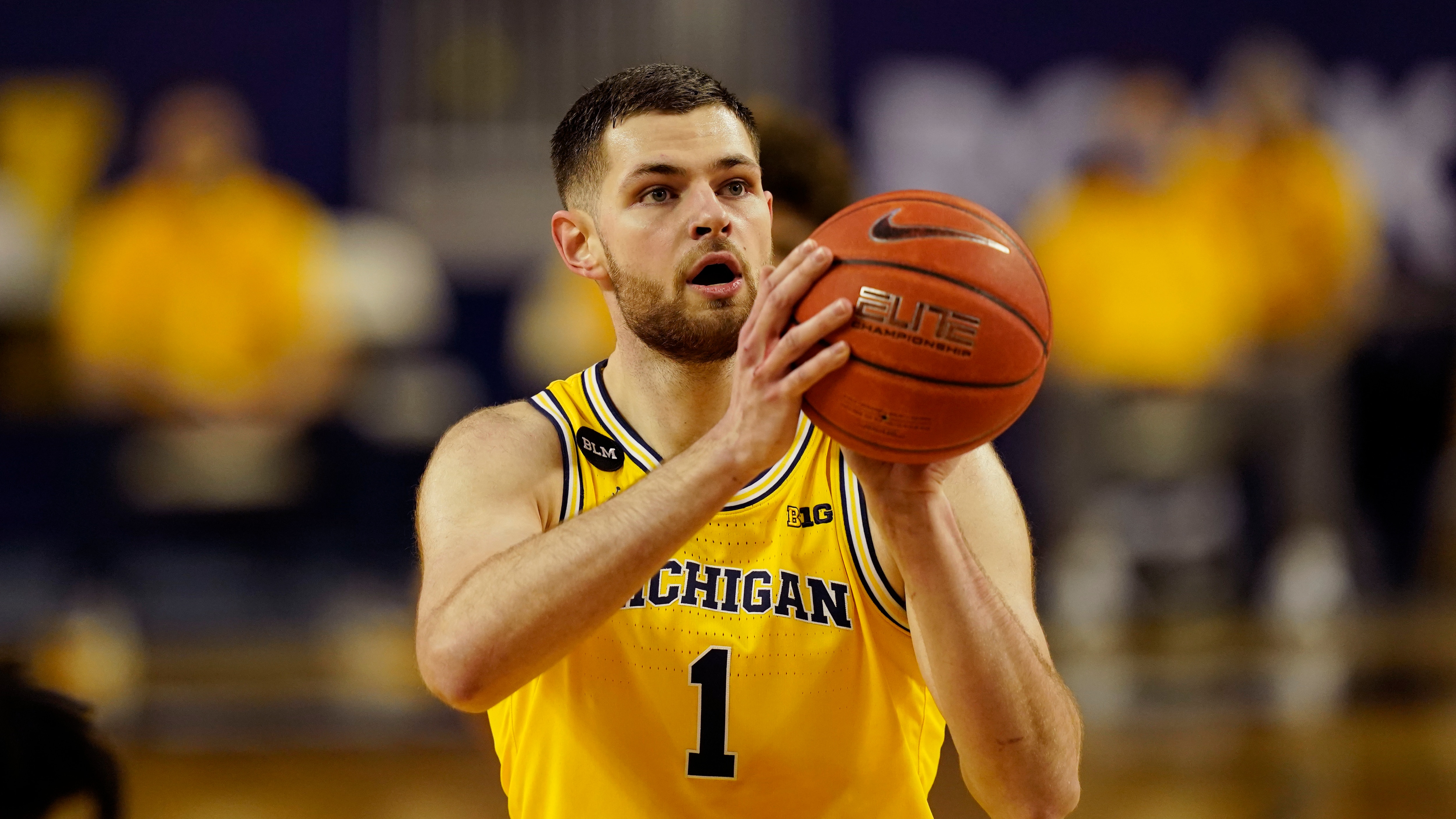 Michigan center Hunter Dickinson plays during the first half of an NCAA college basketball game, Thursday, March 4, 2021, in Ann Arbor, Mich. (AP Photo/Carlos Osorio)