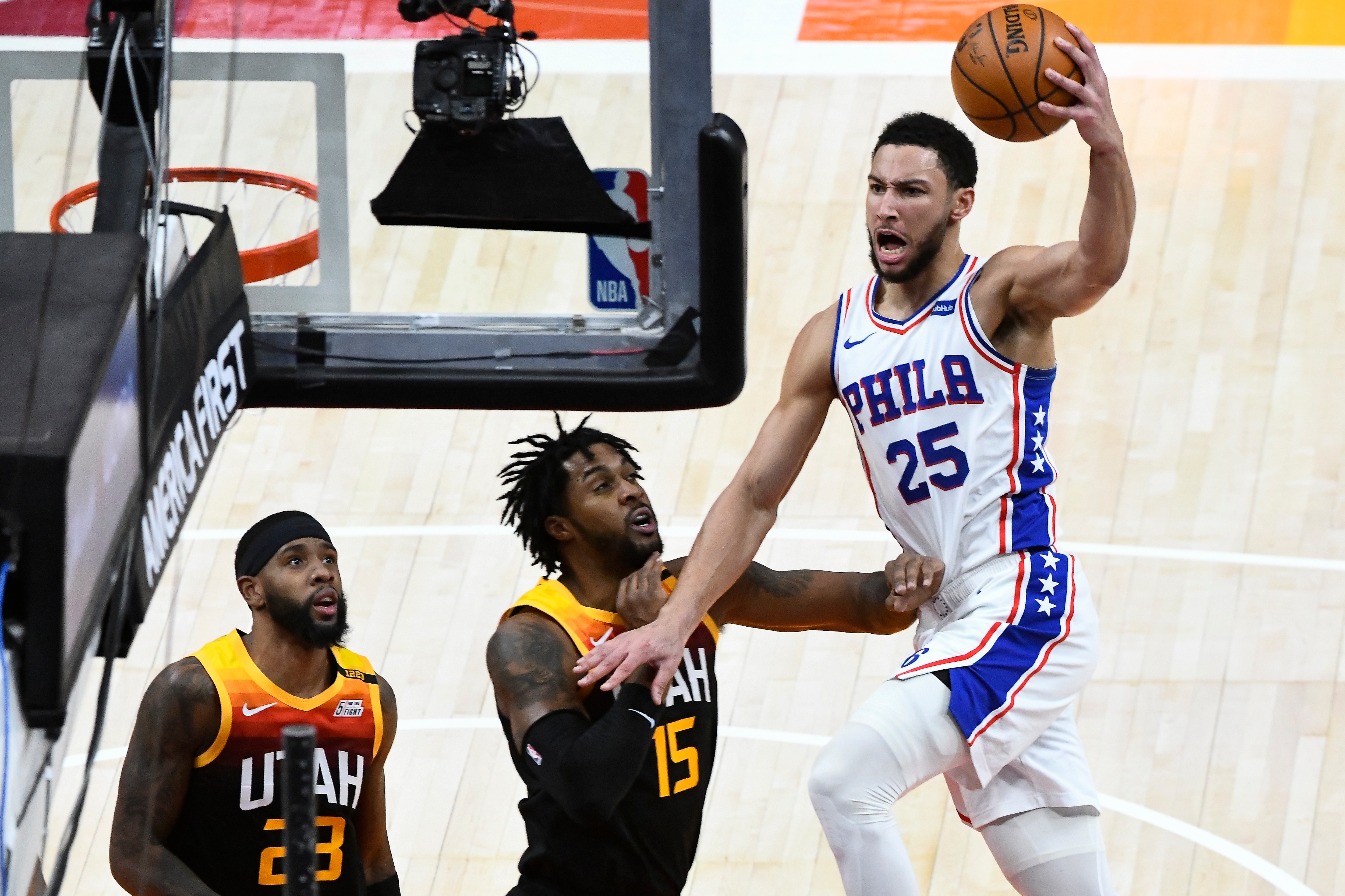 SALT LAKE CITY, UTAH - FEBRUARY 15:  Ben Simmons #25 of the Philadelphia 76ers attempts a shot over Derrick Favors #15 of the Utah Jazz during a game at Vivint Smart Home Arena on February 15, 2021 in Salt Lake City, Utah. NOTE TO USER: User expressly acknowledges and agrees that, by downloading and/or using this photograph, user is consenting to the terms and conditions of the Getty Images License Agreement.  (Photo by Alex Goodlett/Getty Images)