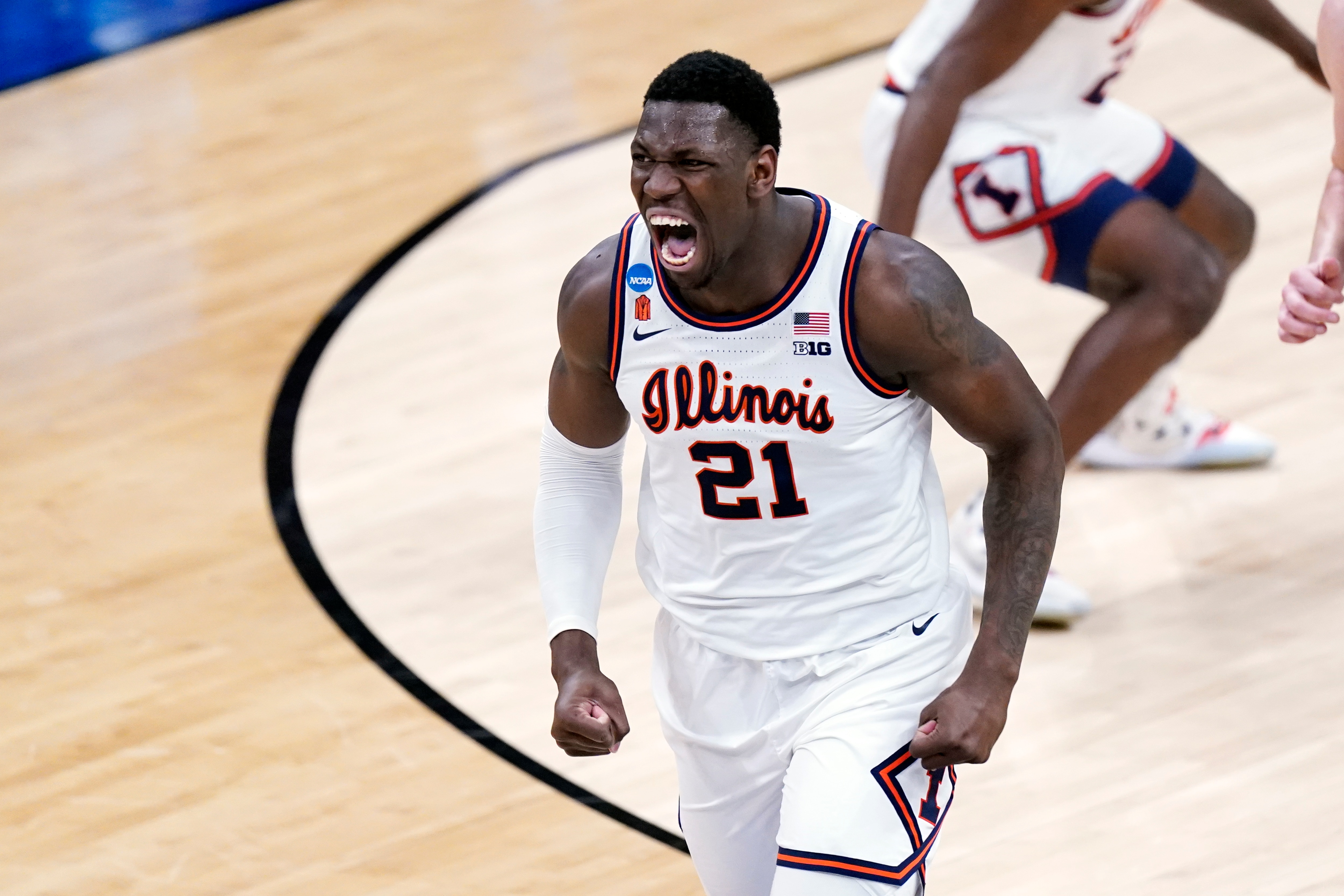 Illinois' Kofi Cockburn screams after scoring against Loyola during the first half of a college basketball game in the second round of the NCAA tournament at Bankers Life Fieldhouse in Indianapolis Sunday, March 21, 2021. (AP Photo/Mark Humphrey)