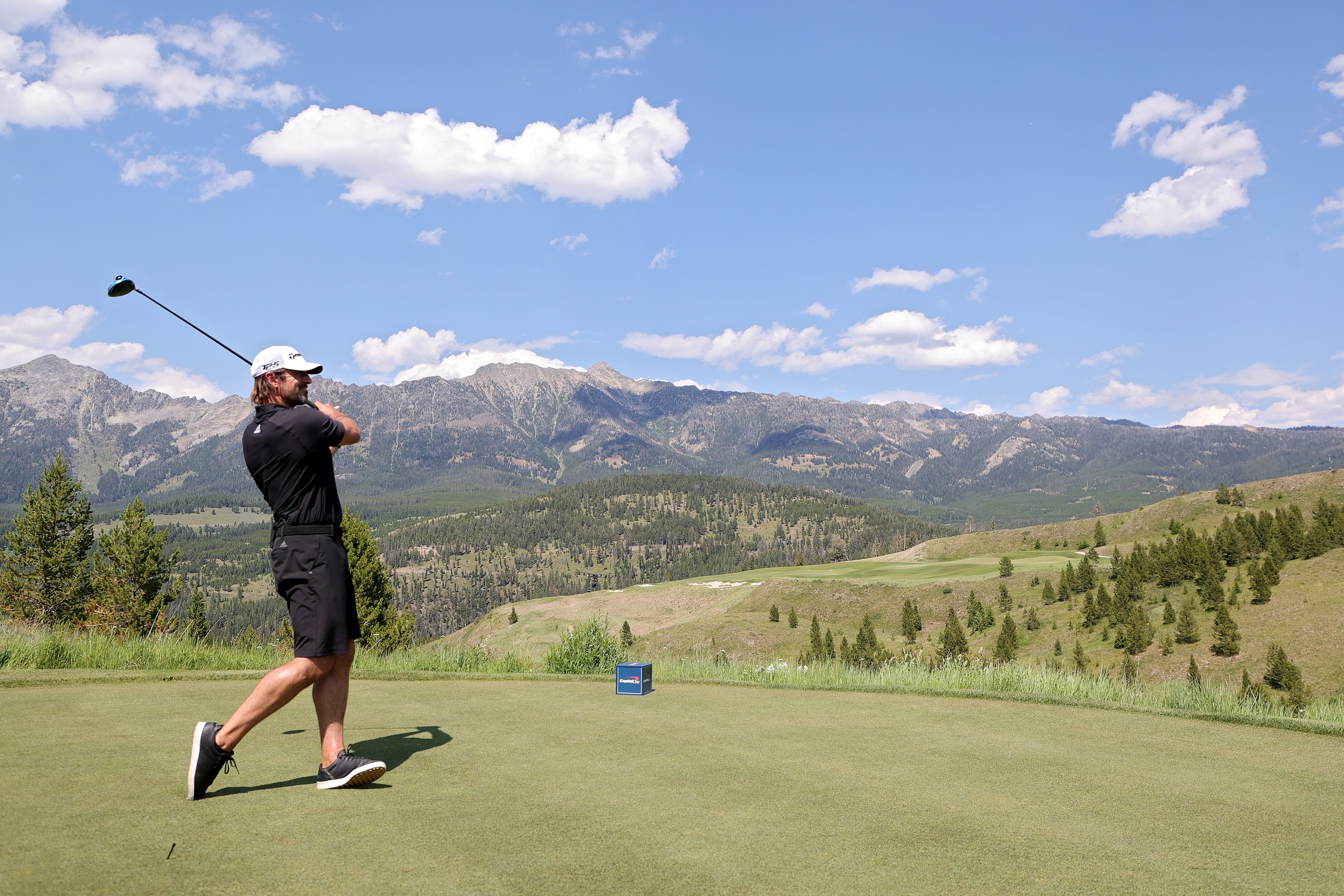BIG SKY, MONTANA - JULY 06: Aaron Rodgers plays his shot from the first tee during Capital One's The Match at The Reserve at Moonlight Basin on July 06, 2021 in Big Sky, Montana. (Photo by Stacy Revere/Getty Images for The Match)