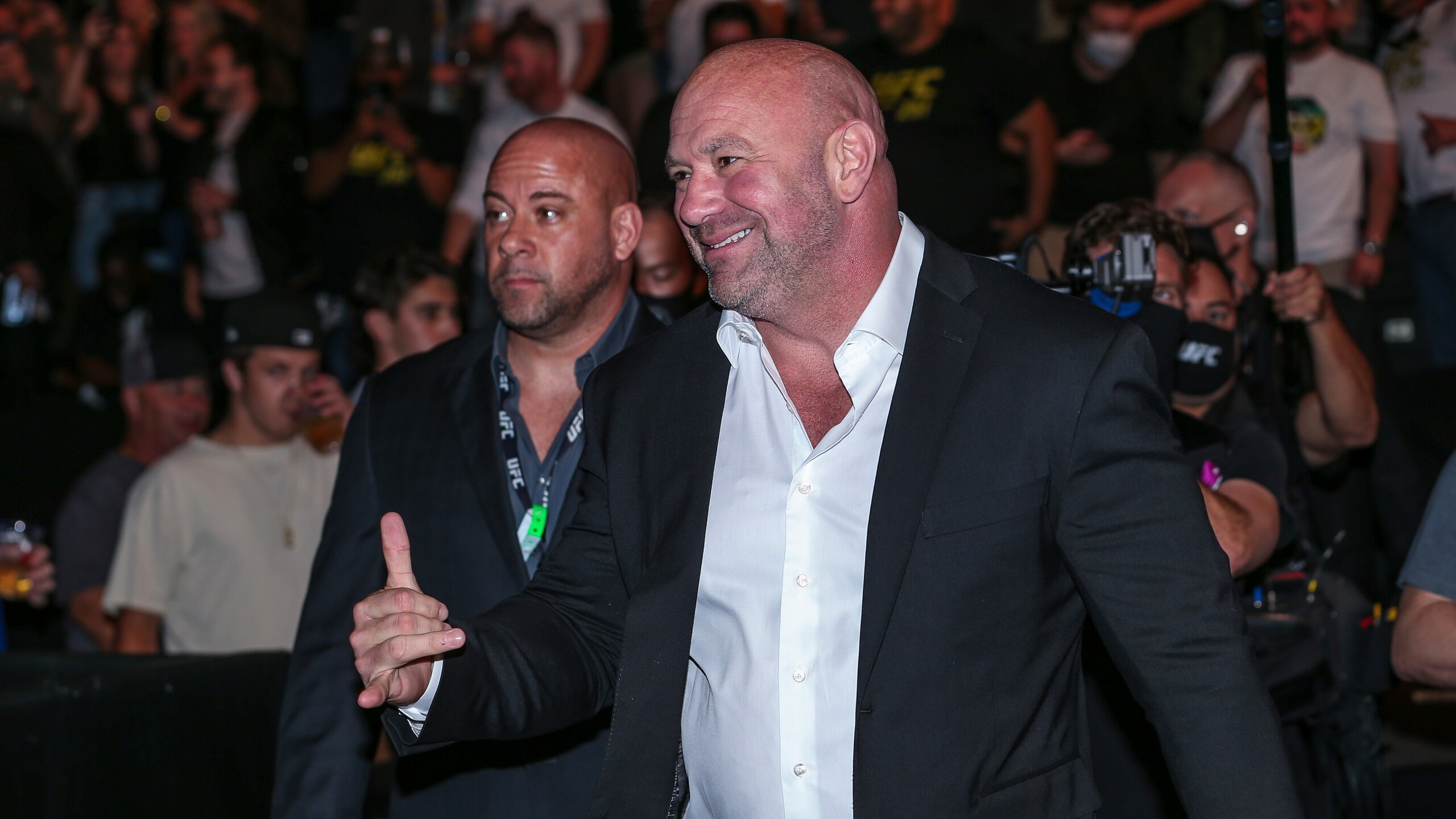 UFC President Dana White interacts with fans during a UFC 261 mixed martial arts event, Saturday, April 24, 2021, in Jacksonville, Fla. This is the first UFC event since the onset of the COVID-19 pandemic to feature a full crowd in attendance. (AP Photo/Gary McCullough)