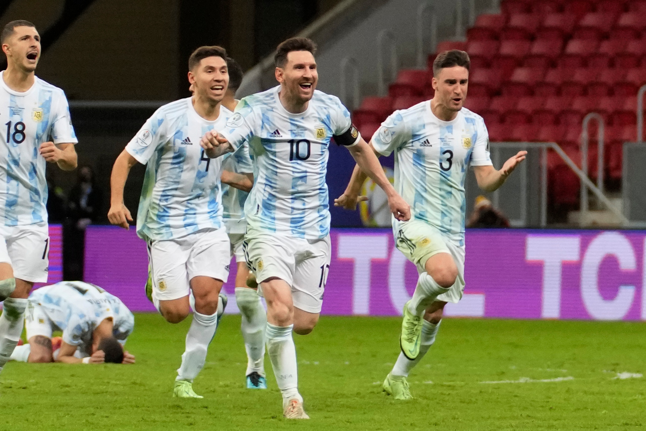 Argentina's Lionel Messi (10) and teammates celebrate defeating Colombia in a penalty shootout during a Copa America semifinal soccer match at the National stadium in Brasilia, Brazil, Wednesday, July 7, 2021. (AP Photo/Andre Penner)