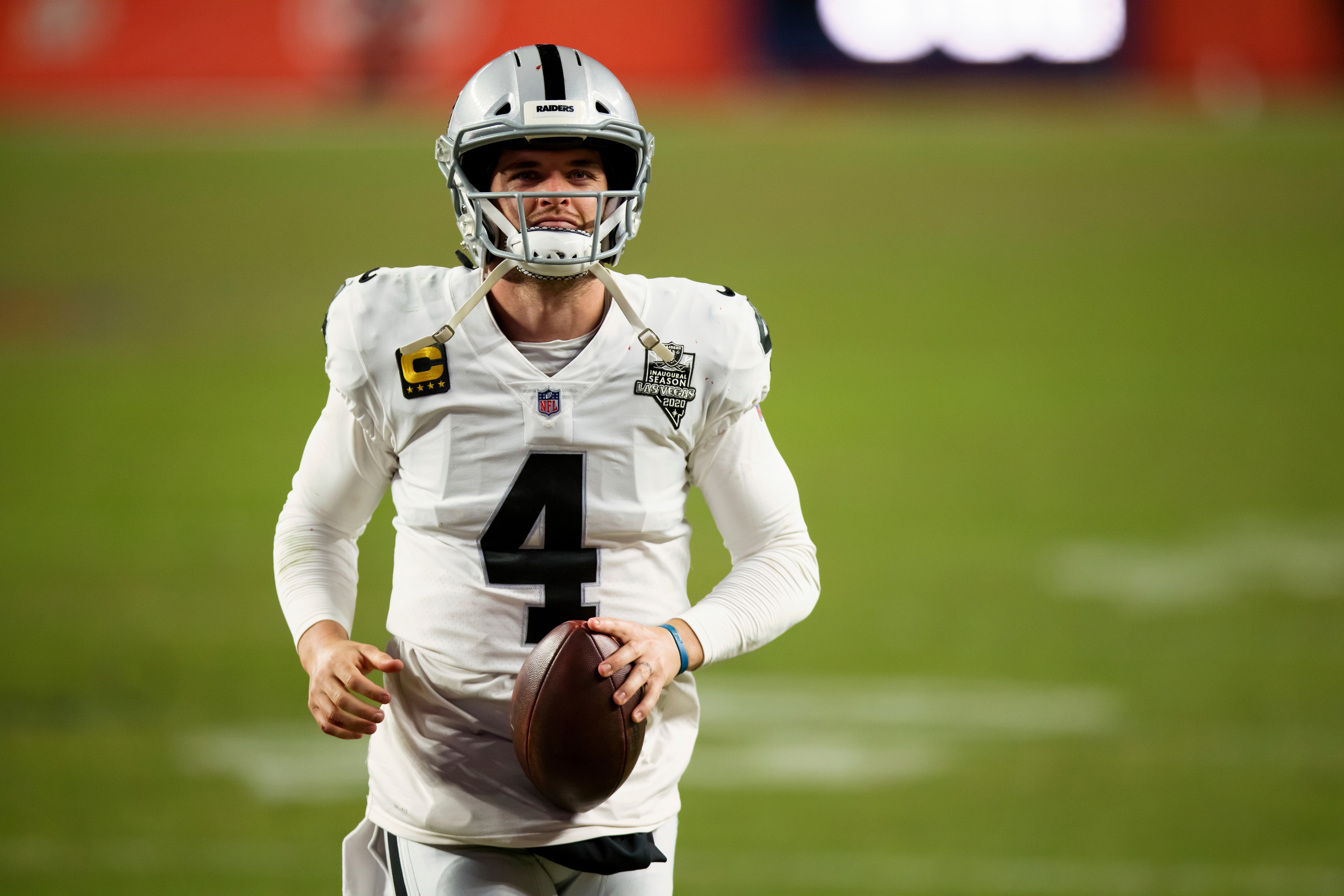 Las Vegas Raiders quarterback Derek Carr (4) walks off the field after a 32-31 win against the Denver Broncos in an NFL football game, Sunday, Jan.. 3, 2021, in Denver. (AP Photo/Justin Edmonds)