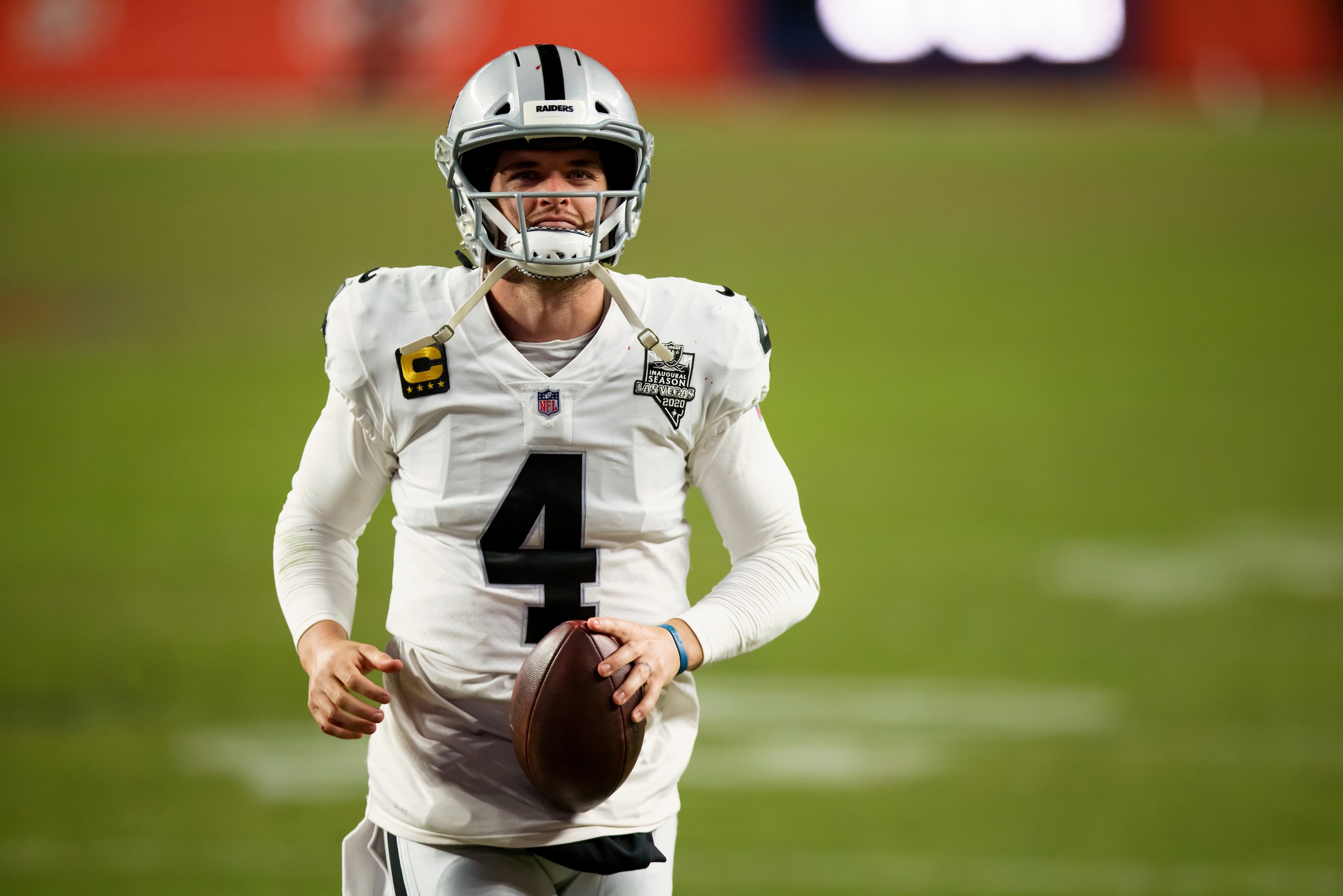 Las Vegas Raiders quarterback Derek Carr (4) walks off the field after a 32-31 win against the Denver Broncos in an NFL football game, Sunday, Jan.. 3, 2021, in Denver. (AP Photo/Justin Edmonds)
