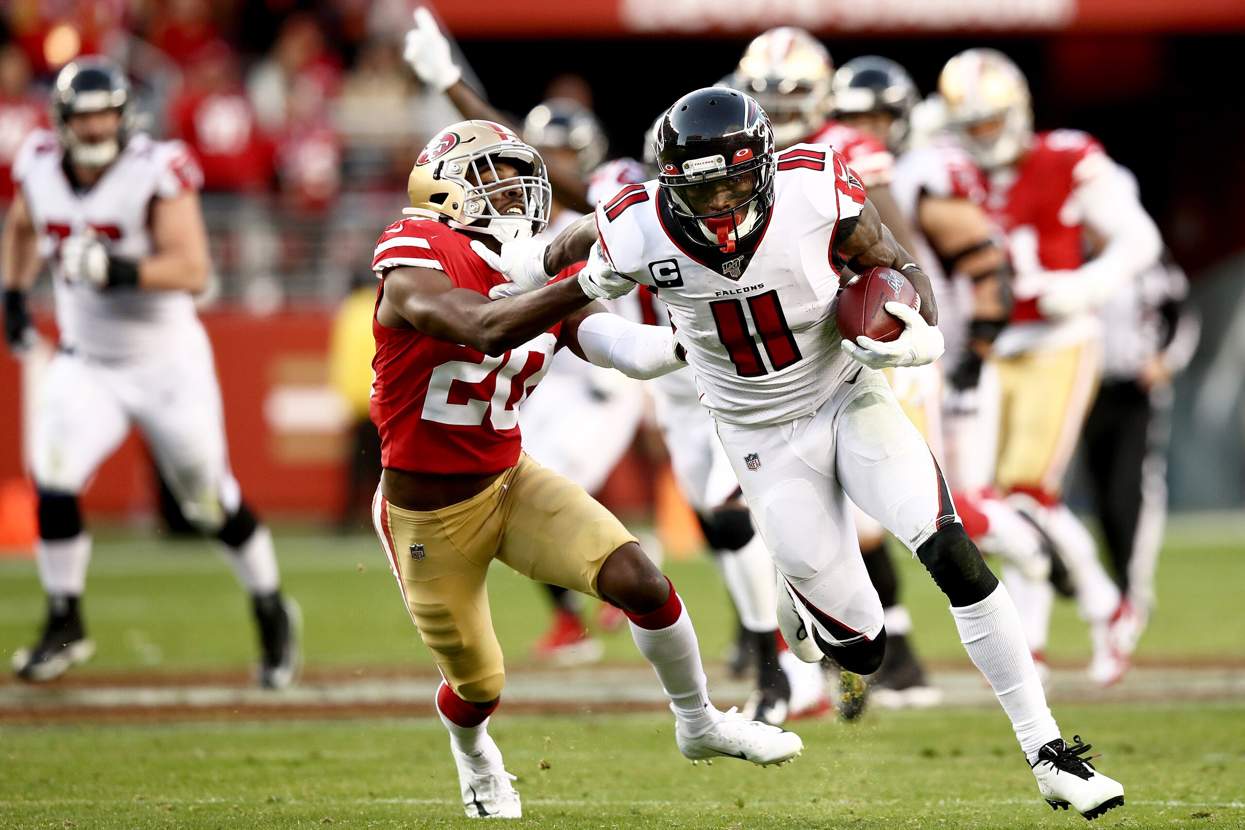 SANTA CLARA, CALIFORNIA - DECEMBER 15: Wide receiver Julio Jones #11 of the Atlanta Falcons carries the ball against free safety Jimmie Ward #20 of the San Francisco 49ers during the game at Levi's Stadium on December 15, 2019 in Santa Clara, California. (Photo by Ezra Shaw/Getty Images)