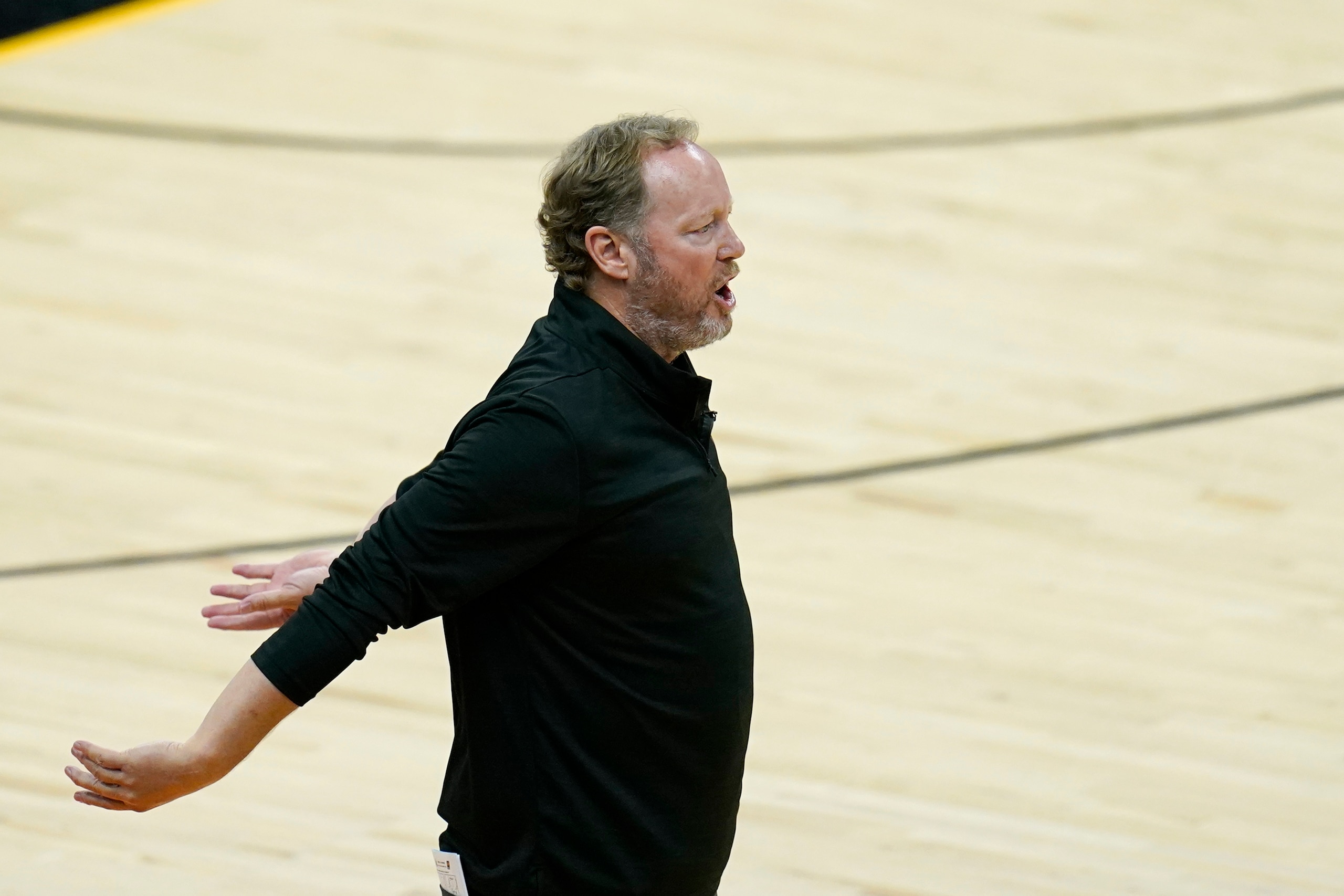 Milwaukee Bucks head coach Mike Budenholzer argues with officials during the second half of Game 1 of basketball's NBA Finals against the Phoenix Suns, Tuesday, July 6, 2021, in Phoenix. The Suns defeated the Bucks 118-105. (AP Photo/Ross D. Franklin)