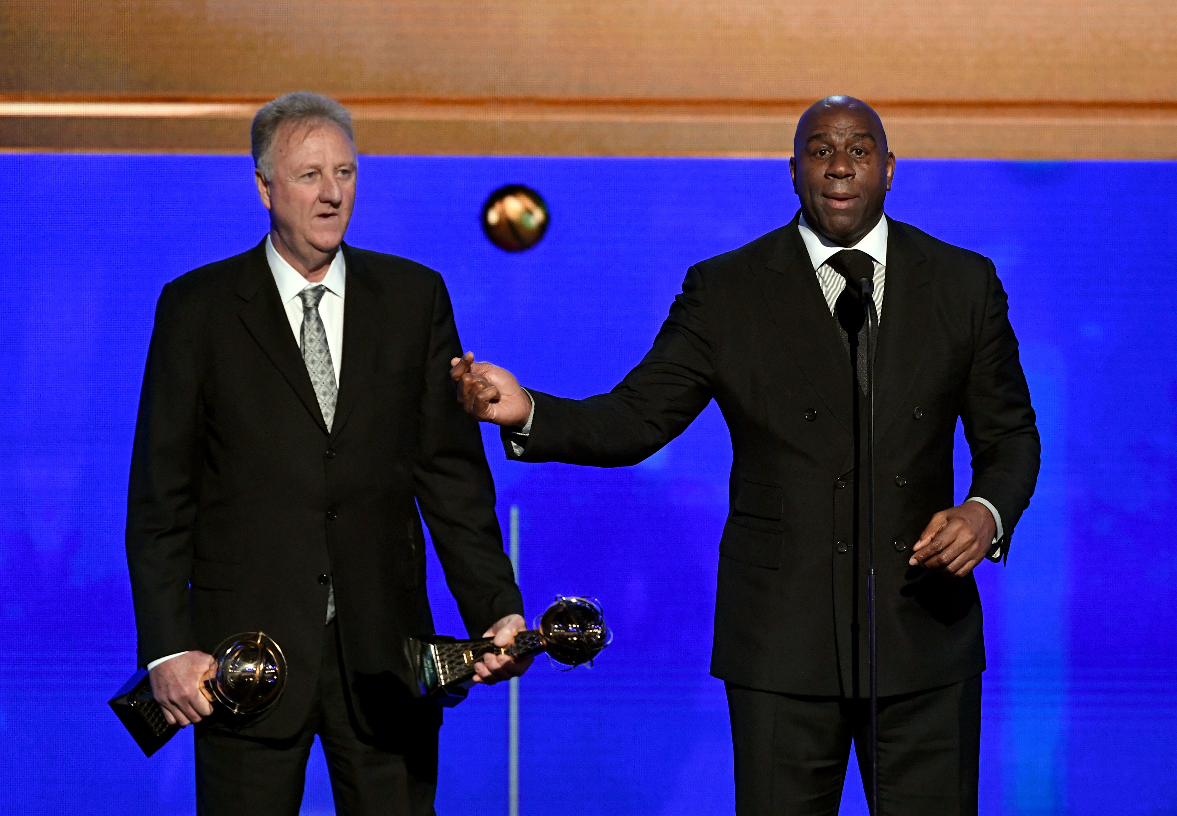 SANTA MONICA, CALIFORNIA - JUNE 24: (L-R) Larry Bird and Magic Johnson accept the Lifetime Achievement Awards onstage during the 2019 NBA Awards presented by Kia on TNT at Barker Hangar on June 24, 2019 in Santa Monica, California. (Photo by Kevin Winter/Getty Images for Turner Sports)
