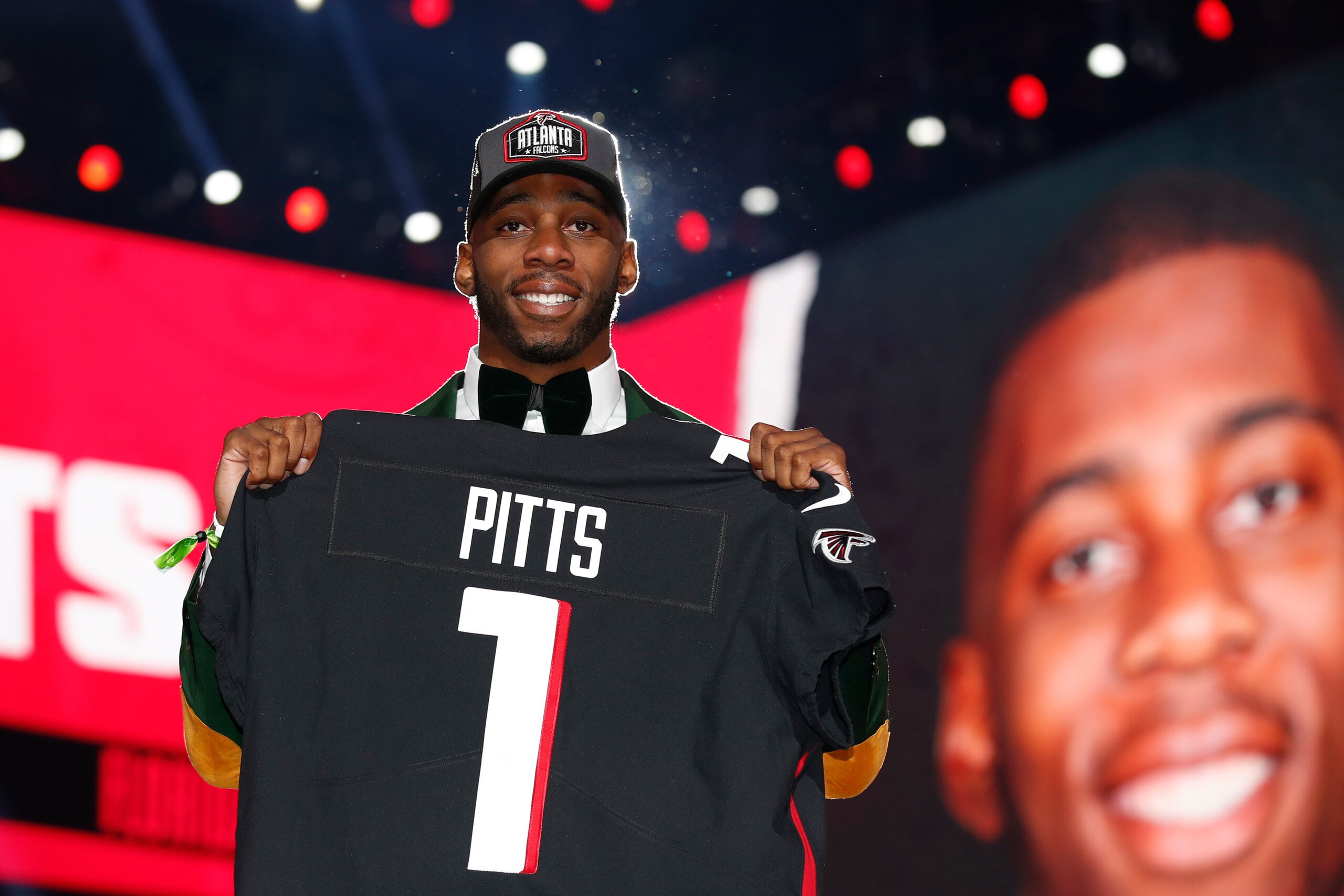 Florida tight end Kyle Pitts holds an Atlanta Falcons jersey after being chosen with the fourth pick in the NFL football draft, Thursday, April 29, 2021, in Cleveland. (Jeff Haynes/AP Images for Panini)