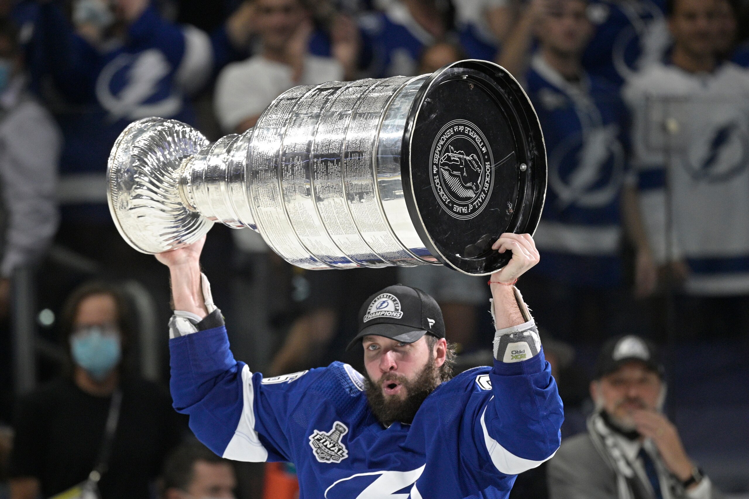 Tampa Bay Lightning right wing Nikita Kucherov hoists the Stanley Cup after the team defeated the Montreal Canadiens in Game 5 of the NHL hockey Stanley Cup finals, Wednesday, July 7, 2021, in Tampa, Fla. (AP Photo/Phelan Ebenhack)