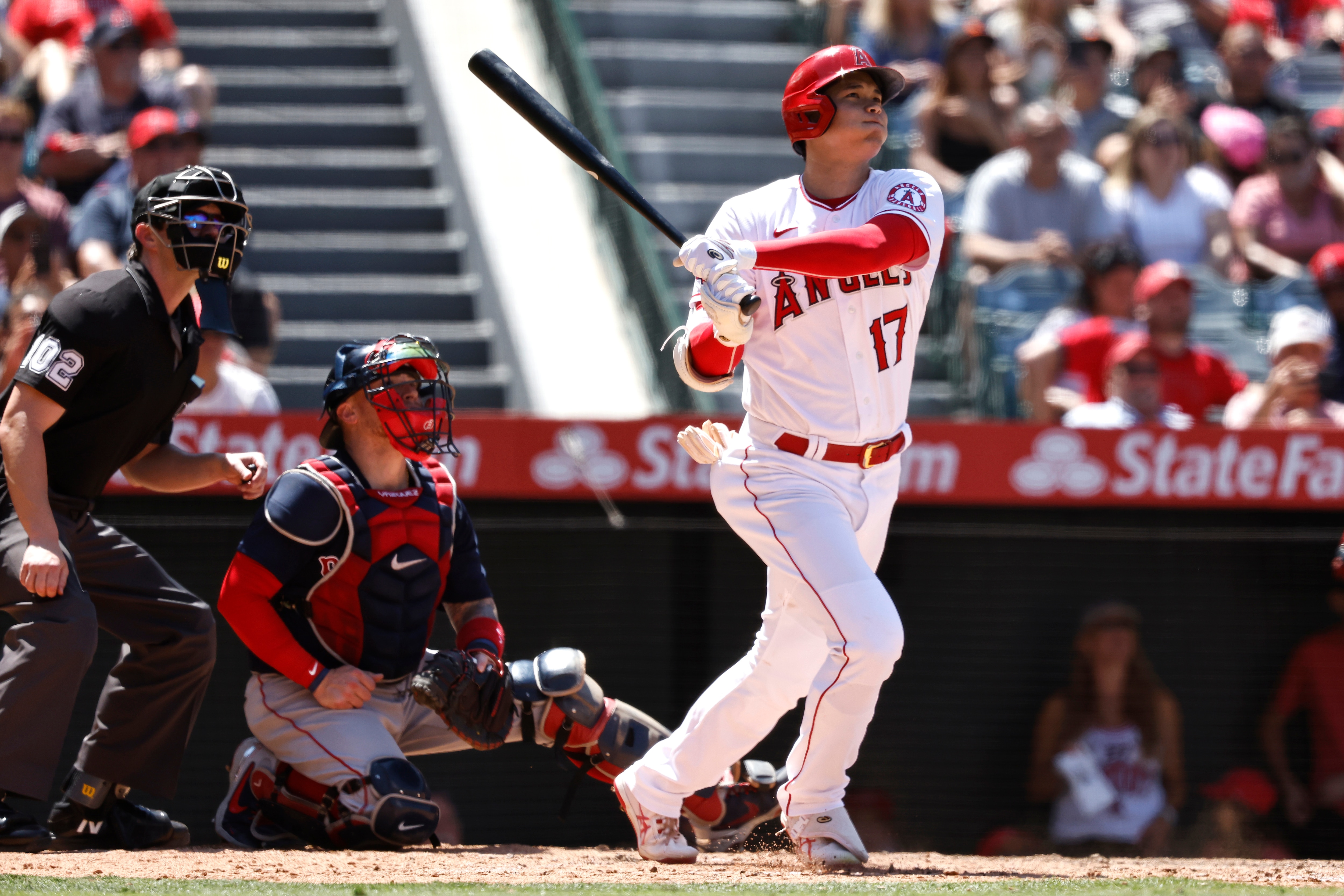 ANAHEIM, CALIFORNIA - JULY 07: Shohei Ohtani #17 of the Los Angeles Angels hits a solo home run against the Boston Red Sox during the fifth inning at Angel Stadium of Anaheim on July 07, 2021 in Anaheim, California. (Photo by Michael Owens/Getty Images)