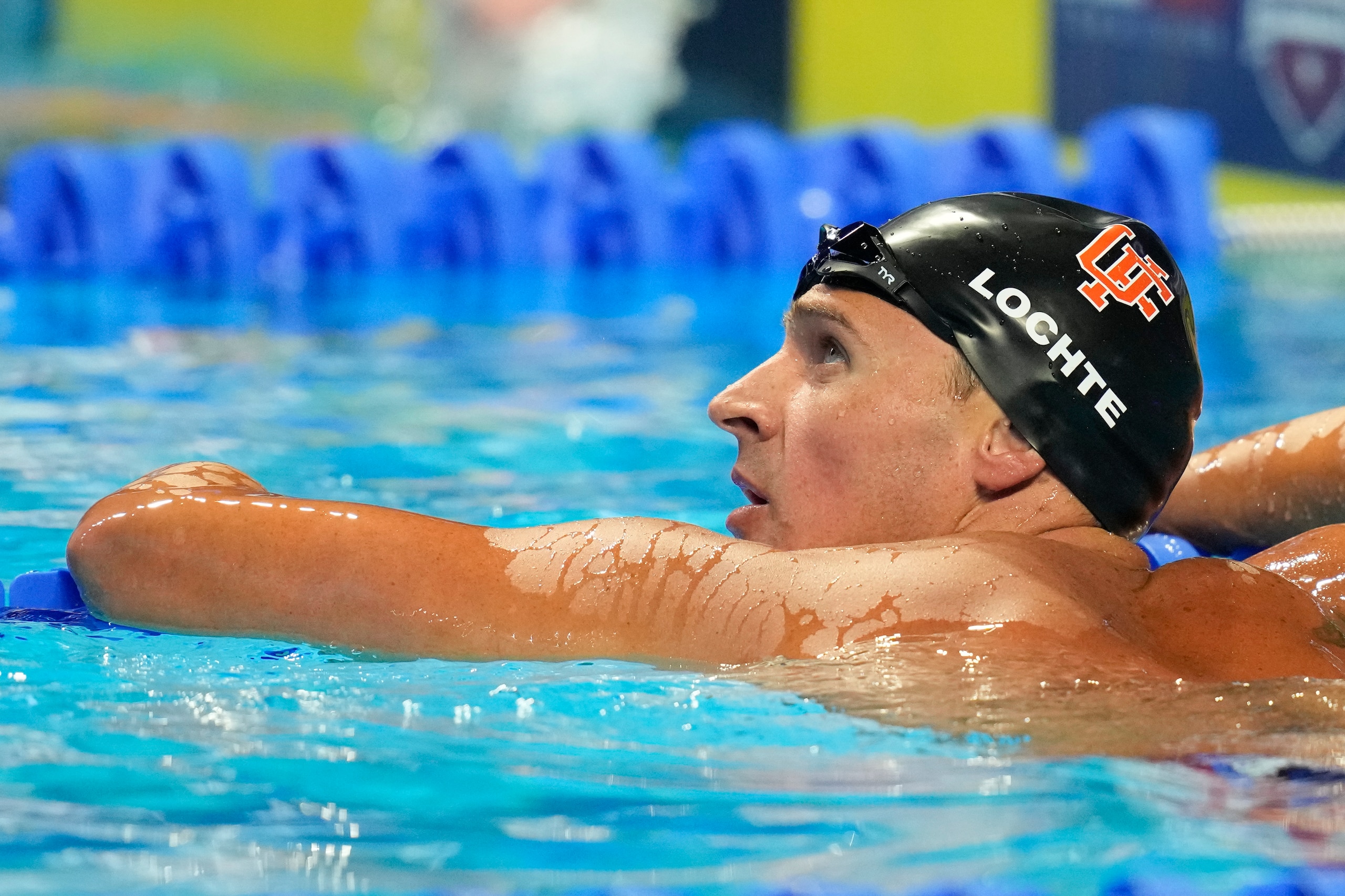 Ryan Lochte checks his time after competing in a men's 200-meter individual medley semifinal heat during wave 2 of the U.S. Olympic Swim Trials on Thursday, June 17, 2021, in Omaha, Neb. (AP Photo/Charlie Neibergall)