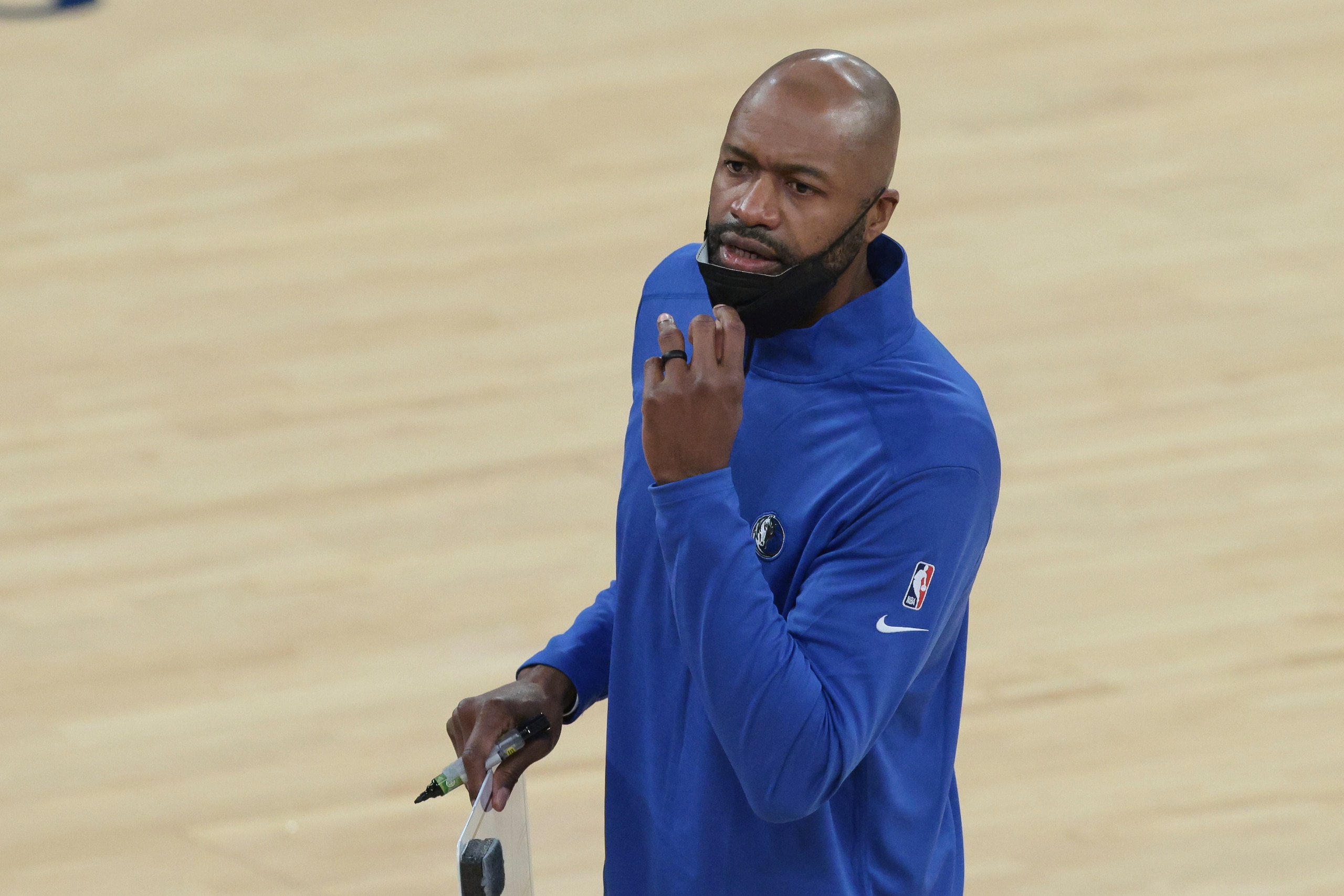 Dallas Mavericks assistant coach Jamahl Mosley stands near the sideline during the first quarter of the team's NBA basketball game against the New York Knicks on Friday, April 2, 2021, in New York. (Vincent Carchietta/Pool Photo via AP)