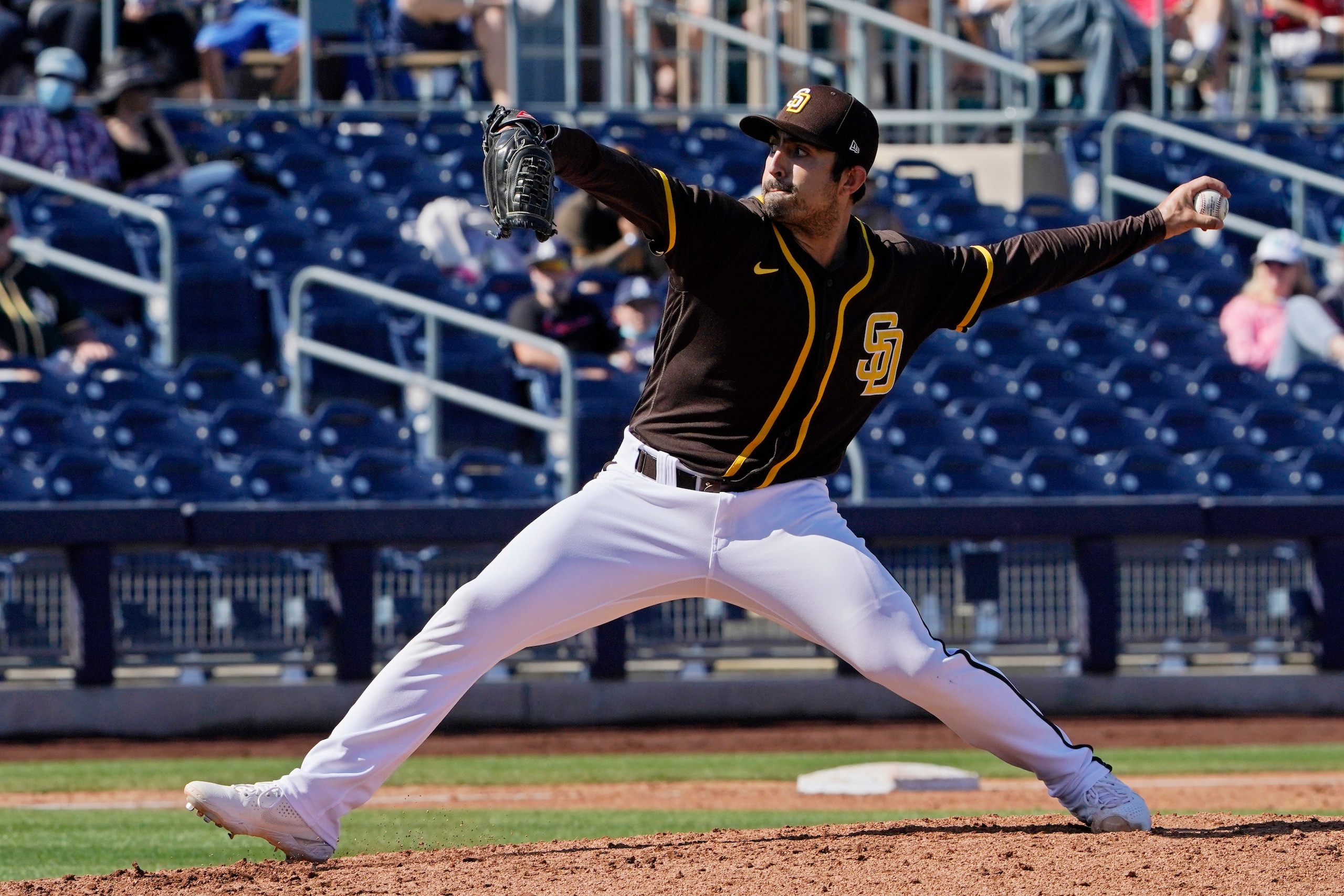 San Diego Padres's Daniel Camarena pitches during a spring training baseball game against the Oakland Athletics, Thursday, March 18, 2021, in Peoria, Ariz. (AP Photo/Sue Ogrocki) San Diego Padres's Daniel Camarena pitches during a spring training baseball game against the Oakland Athletics, Thursday, March 18, 2021, in Peoria, Ariz. (AP Photo/Sue Ogrocki)