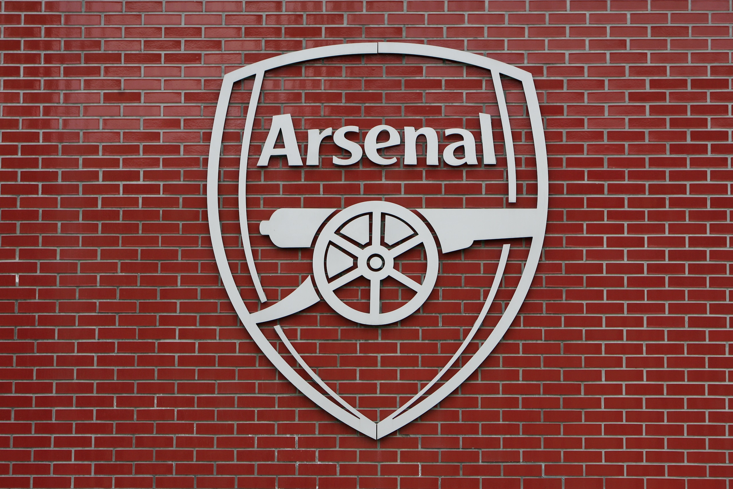 The official Arsenal logo on a wall outside the stadium during the UEFA Champions League Semi-Final 2nd Leg match between Arsenal and Manchester United at the Emirates Stadium in London, England, UK. (Photo by ben radford/Corbis via Getty Images)