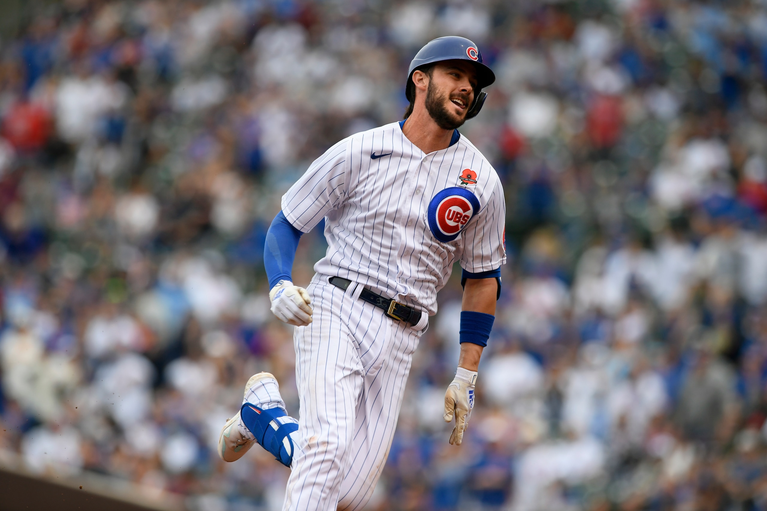 FILE - Chicago Cubs' Kris Bryant runs to third base on his triple during the third inning of a baseball game against the San Diego Padres in Chicago, in this May 31, 2021, file photo. Bryant's versatility, while producing offensive numbers that belong alongside his NL MVP season in 2016, is a big reason why Chicago is on top of the NL Central once again, helping the Cubs go on a 21-9 run while dealing with a rash of injuries. (AP Photo/Paul Beaty, File)