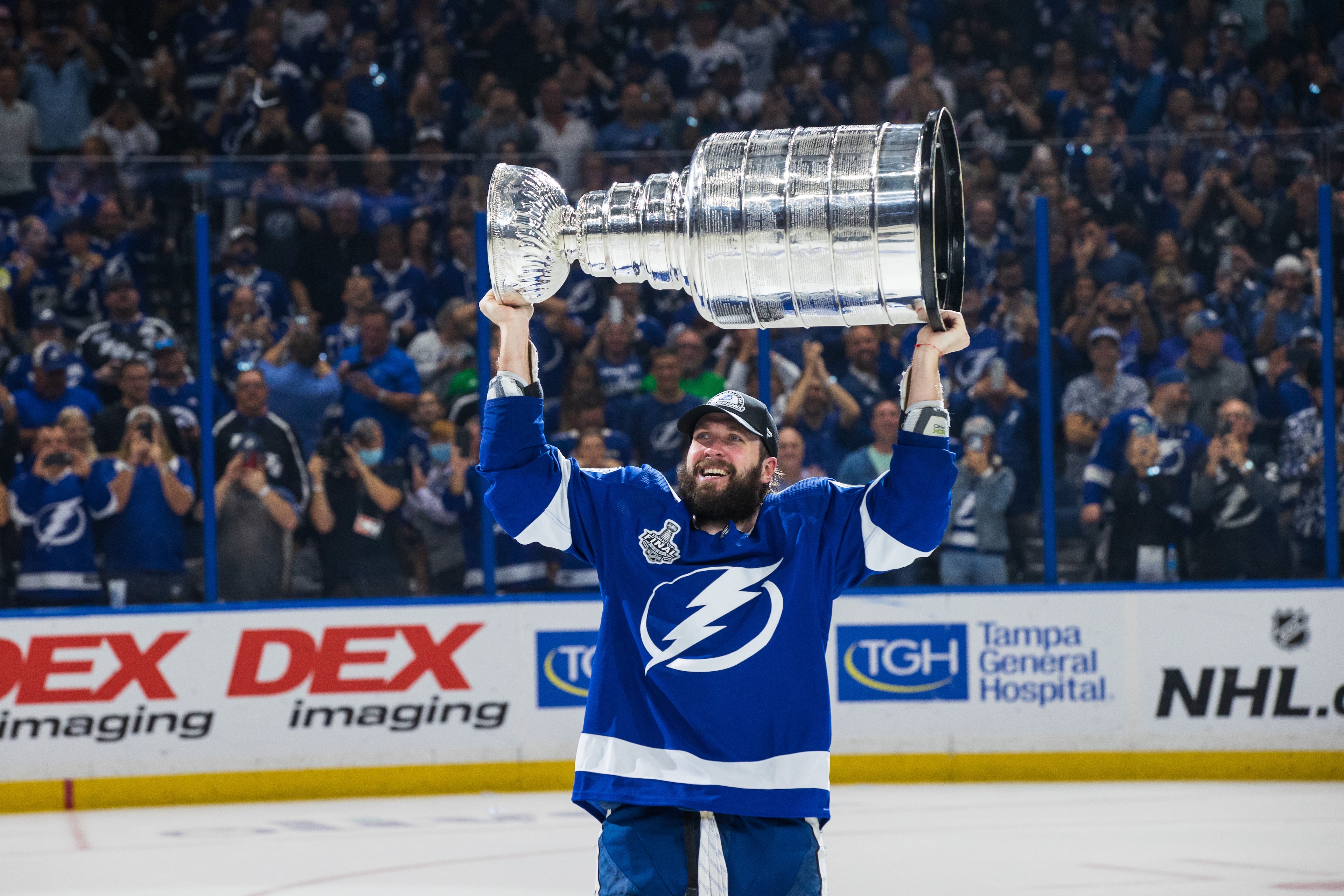 TAMPA, FL - JULY 7: Nikita Kucherov #86 of the Tampa Bay Lightning hoists the Stanley Cup overhead after the Tampa Bay Lightning defeated the Montreal Canadiens in Game Five to win the best of seven game series 4-1 during the Stanley Cup Final of the 2021 Stanley Cup Playoffs at Amalie Arena on July 7, 2021 in Tampa, Florida. (Photo by Scott Audette/NHLI via Getty Images) TAMPA, FL - JULY 7: Nikita Kucherov #86 of the Tampa Bay Lightning hoists the Stanley Cup overhead after the Tampa Bay Lightning defeated the Montreal Canadiens in Game Five to win the best of seven game series 4-1 during the Stanley Cup Final of the 2021 Stanley Cup Playoffs at Amalie Arena on July 7, 2021 in Tampa, Florida. (Photo by Scott Audette/NHLI via Getty Images)
