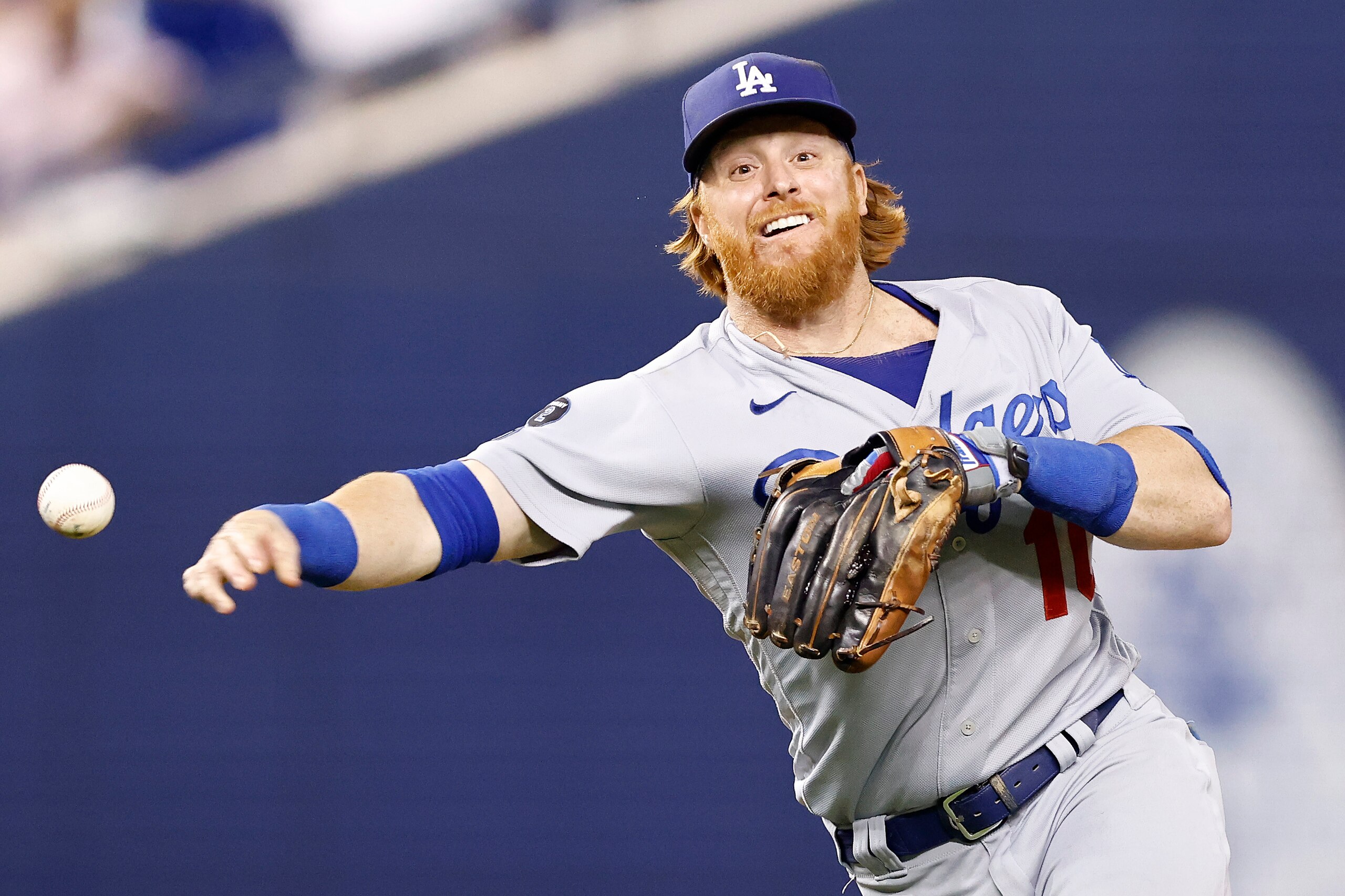MIAMI, FLORIDA - JULY 06: Justin Turner #10 of the Los Angeles Dodgers throws out a runner at first base against the Miami Marlins during the seventh inning at loanDepot park on July 06, 2021 in Miami, Florida. (Photo by Michael Reaves/Getty Images)