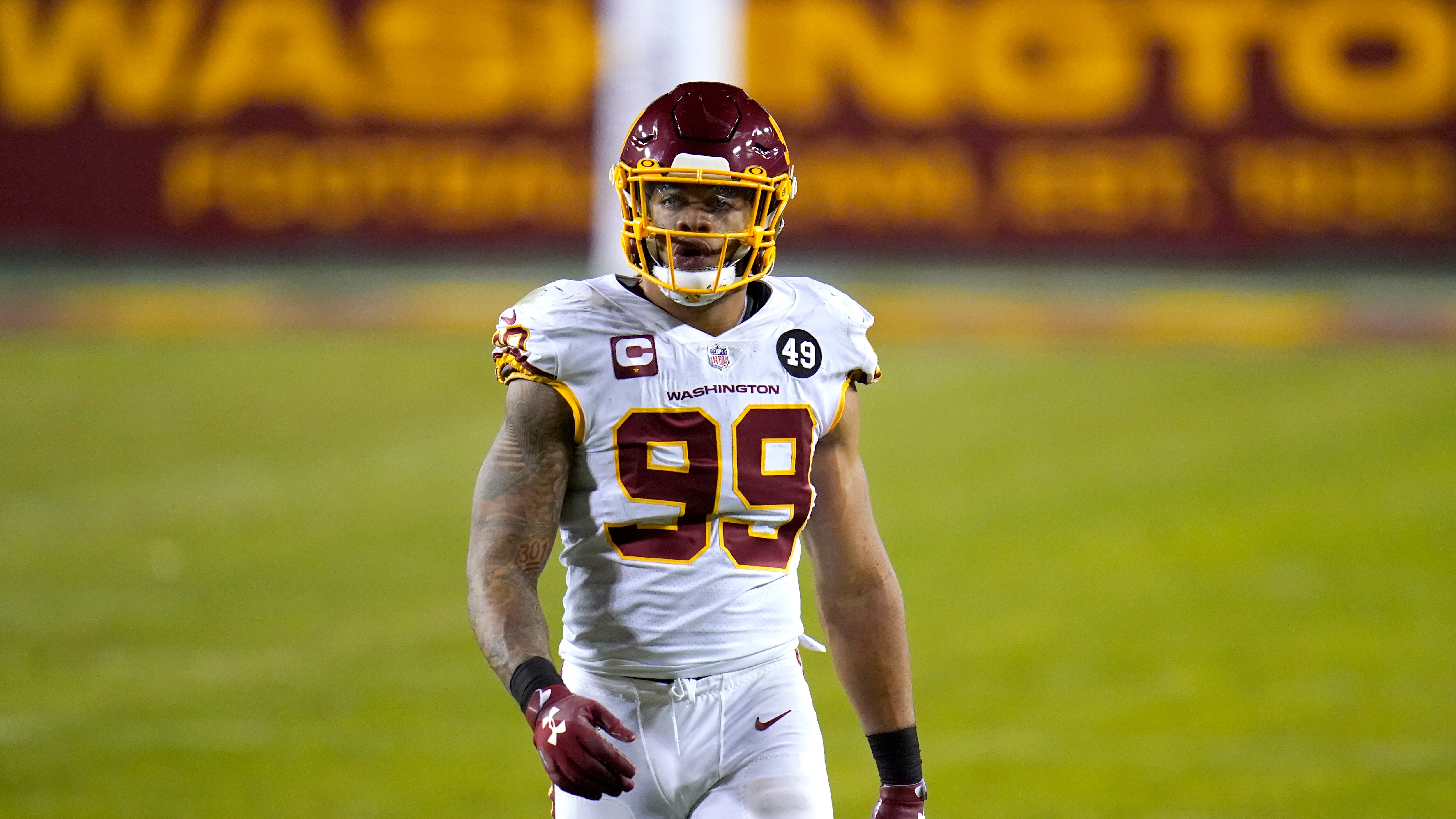 Washington Football Team defensive end Chase Young looks on during the second half of an NFL wild-card playoff football game against the Tampa Bay Buccaneers, Saturday, Jan. 9, 2021, in Landover, Md. Tampa Bay won 31-23. (AP Photo/Julio Cortez)