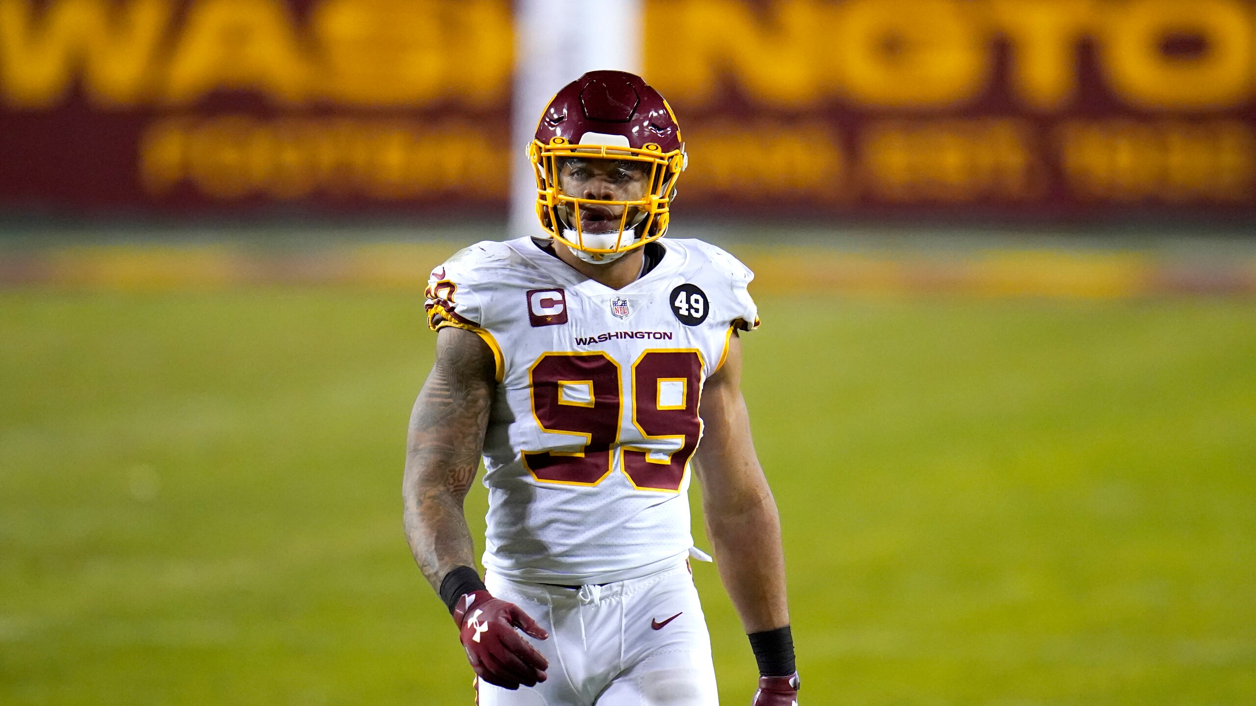 Washington Football Team defensive end Chase Young looks on during the second half of an NFL wild-card playoff football game against the Tampa Bay Buccaneers, Saturday, Jan. 9, 2021, in Landover, Md. Tampa Bay won 31-23. (AP Photo/Julio Cortez)