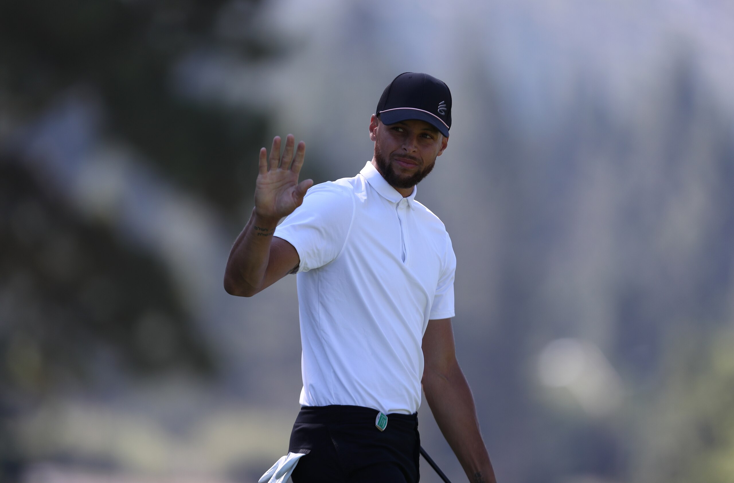 SOUTH LAKE TAHOE, NEVADA - JULY 10: NBA athlete Steph Curry waves on the second hole during round two of the American Century Championship at Edgewood Tahoe South golf course on July 10, 2020 in South Lake Tahoe, Nevada.  (Photo by Jed Jacobsohn/Getty Images)