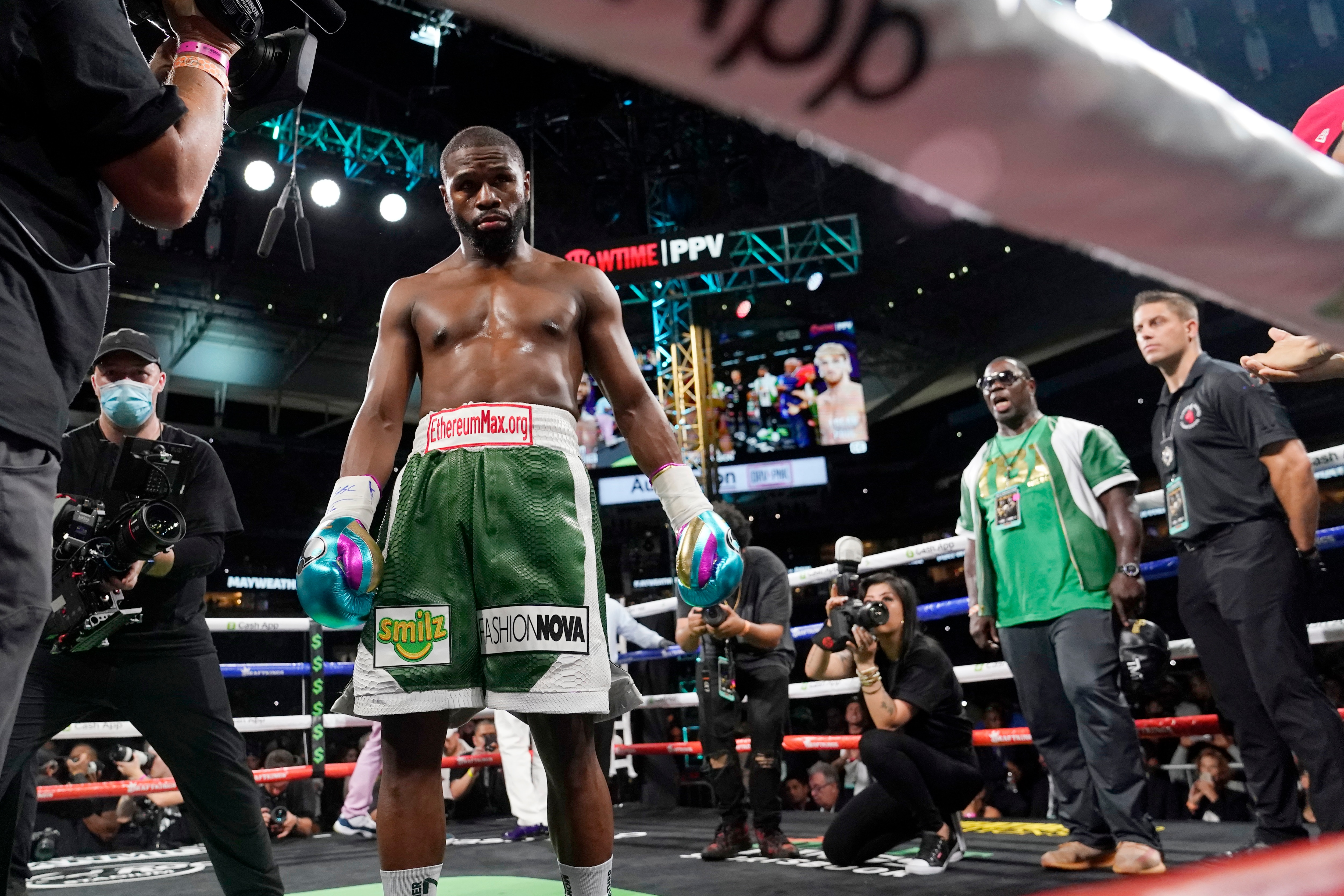 Floyd Mayweather walks in the ring before an exhibition boxing match against Logan Paul at Hard Rock Stadium, Sunday, June 6, 2021, in Miami Gardens, Fla. (AP Photo/Lynne Sladky)