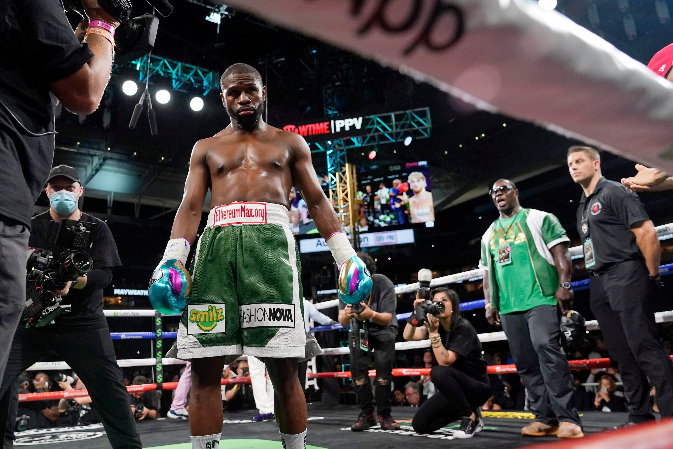 Floyd Mayweather walks in the ring before an exhibition boxing match against Logan Paul at Hard Rock Stadium, Sunday, June 6, 2021, in Miami Gardens, Fla. (AP Photo/Lynne Sladky)