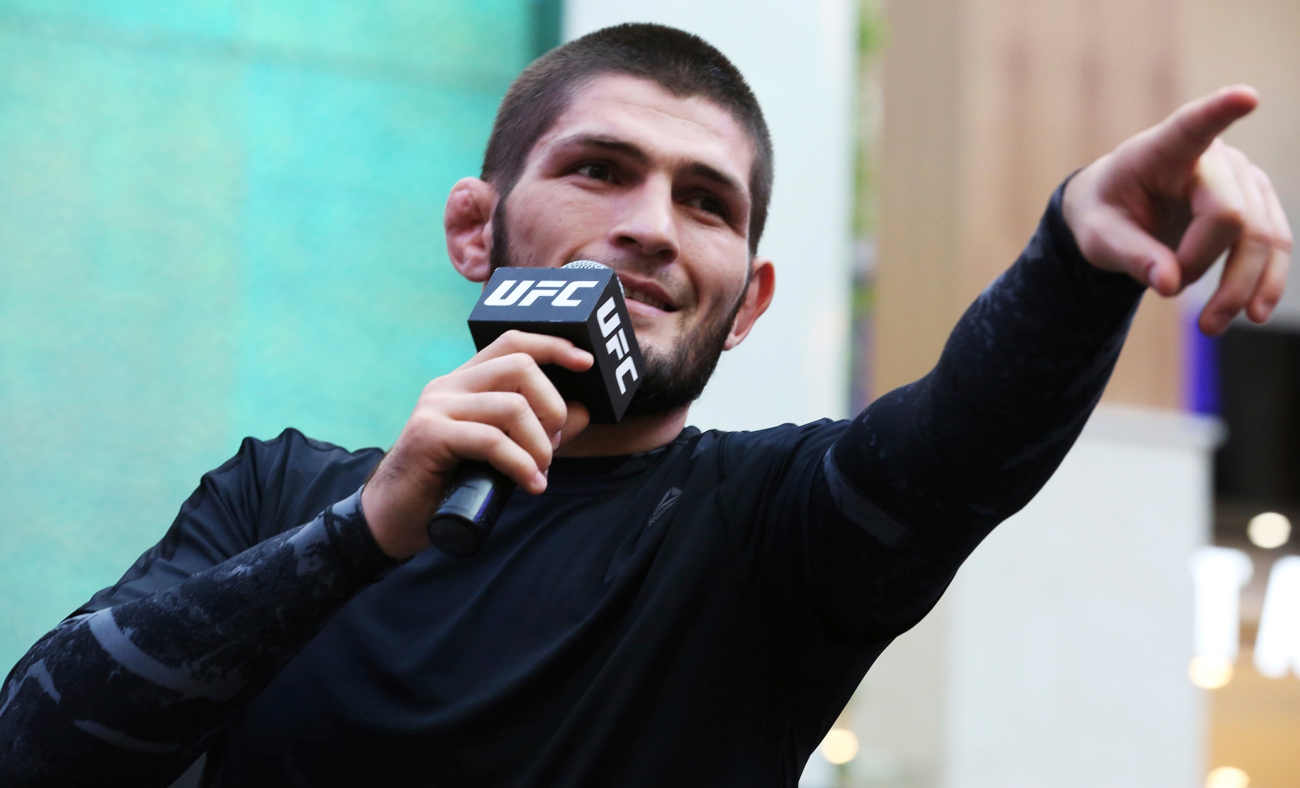 Russian UFC fighter Khabib Nurmagomedov gestures to the crowd during an open training session at Yas Mall in Abu Dhabi, United Arab Emirates, Wednesday, Sept. 4, 2019. Fighters Dustin Poirier and Khabib Nurmagomedov will face each other in UFC 242, which will be held Saturday, Sept. 7, 2019, in Abu Dhabi. Nurmagomedov did not spar during the open training, saying he was still trying to make weight for the bout. (AP Photo/Jon Gambrell) Russian UFC fighter Khabib Nurmagomedov gestures to the crowd during an open training session at Yas Mall in Abu Dhabi, United Arab Emirates, Wednesday, Sept. 4, 2019. Fighters Dustin Poirier and Khabib Nurmagomedov will face each other in UFC 242, which will be held Saturday, Sept. 7, 2019, in Abu Dhabi. Nurmagomedov did not spar during the open training, saying he was still trying to make weight for the bout. (AP Photo/Jon Gambrell)