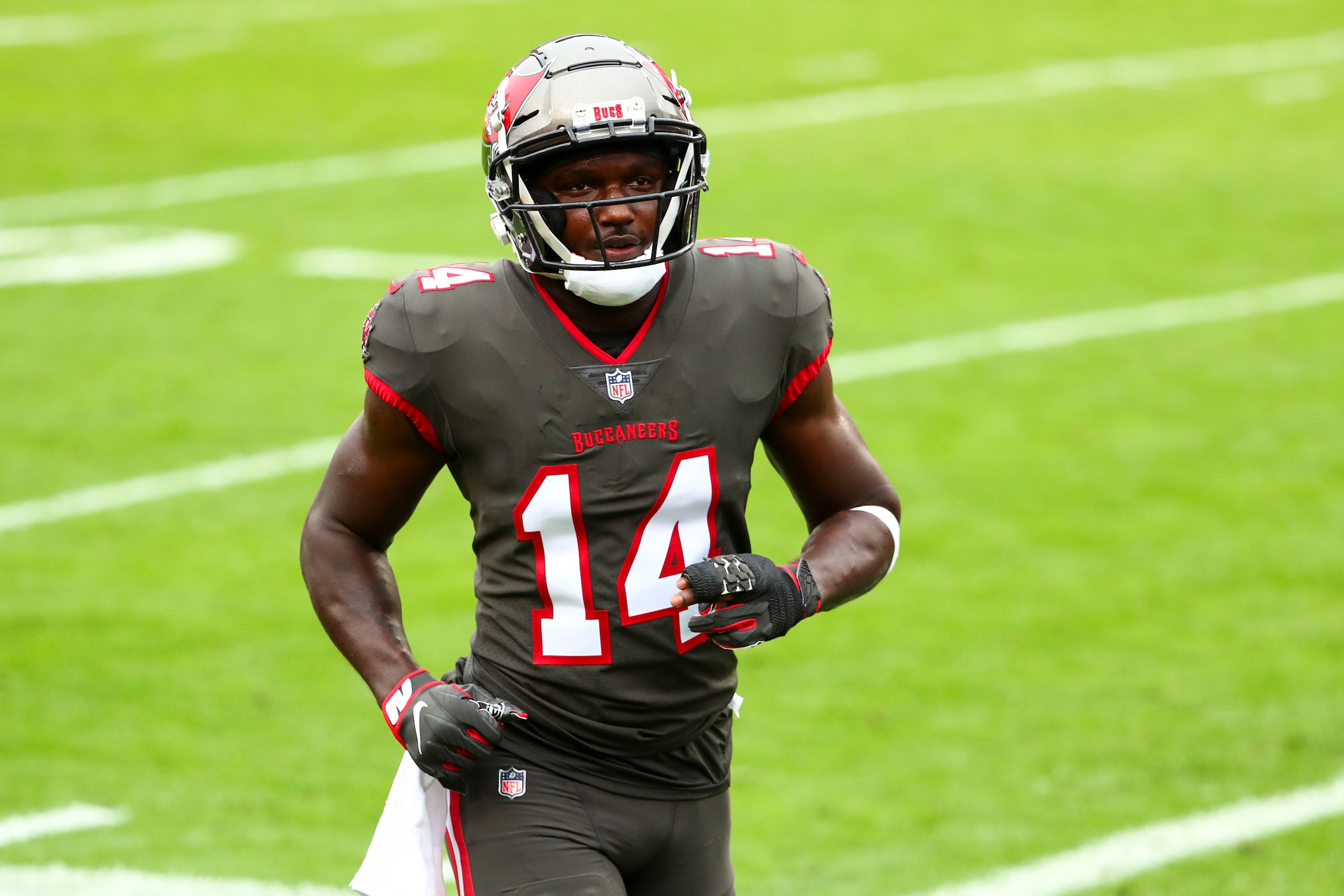 Tampa Bay Buccaneers wide receiver Chris Godwin (14) walks to the locker room prior to an NFL football game against the Atlanta Falcons, Sunday, Jan. 3, 2021, in Tampa, Fla. (AP Photo/Kevin Sabitus)