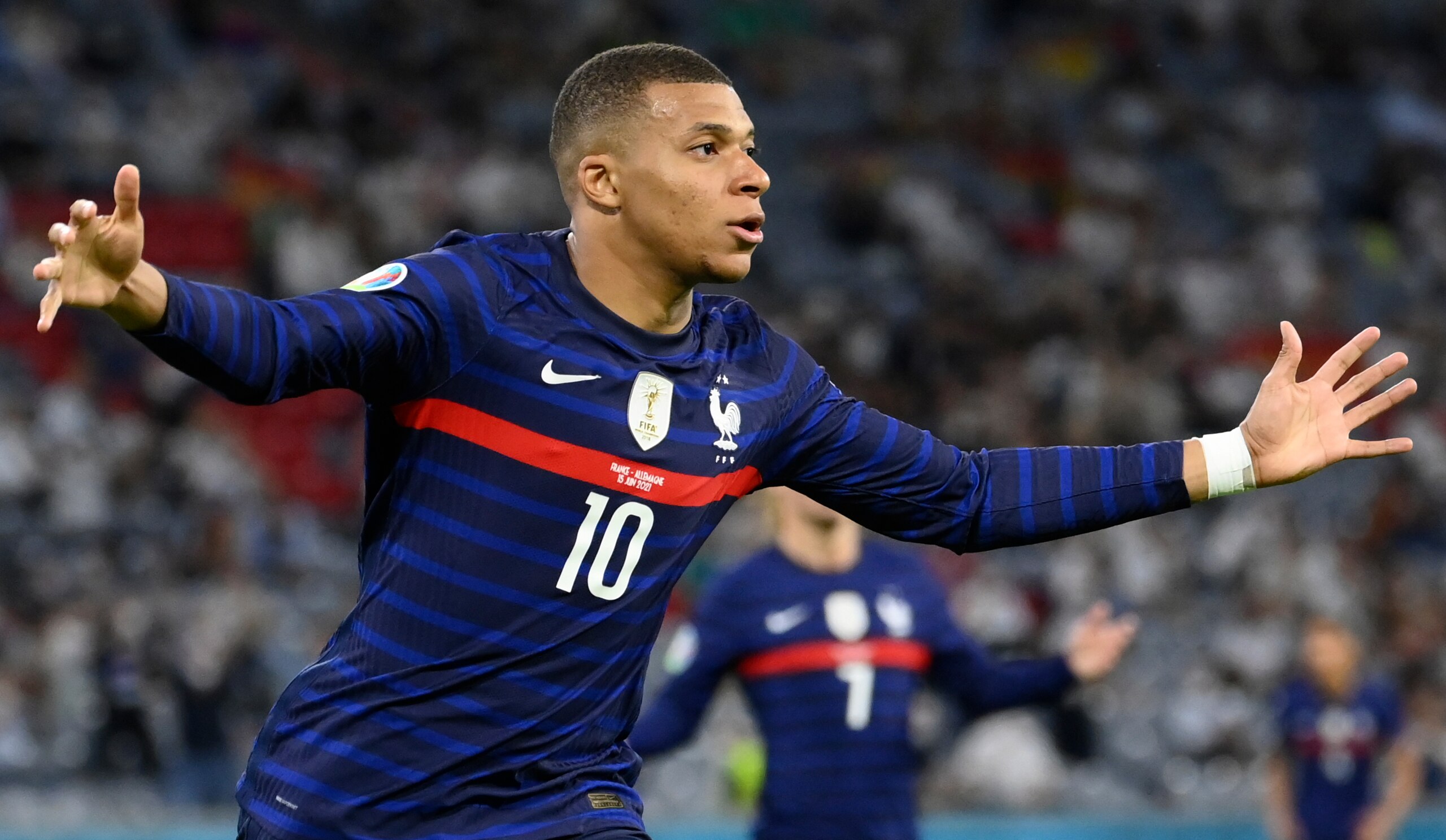 France's Kylian Mbappe runs to celebrate scoring a goal that was overturned for an offside during the Euro 2020 soccer championship group F match between Germany and France at the Allianz Arena stadium in Munich, Tuesday, June 15, 2021. (Franck Fife/Pool via AP)