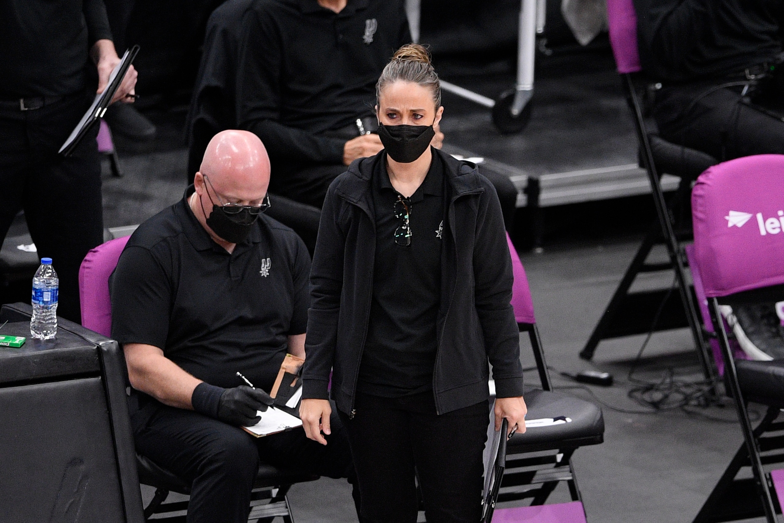 San Antonio Spurs assistant coach Becky Hammon stands on the court during the first half of an NBA basketball game against the Washington Wizards, Monday, April 26, 2021, in Washington. (AP Photo/Nick Wass)