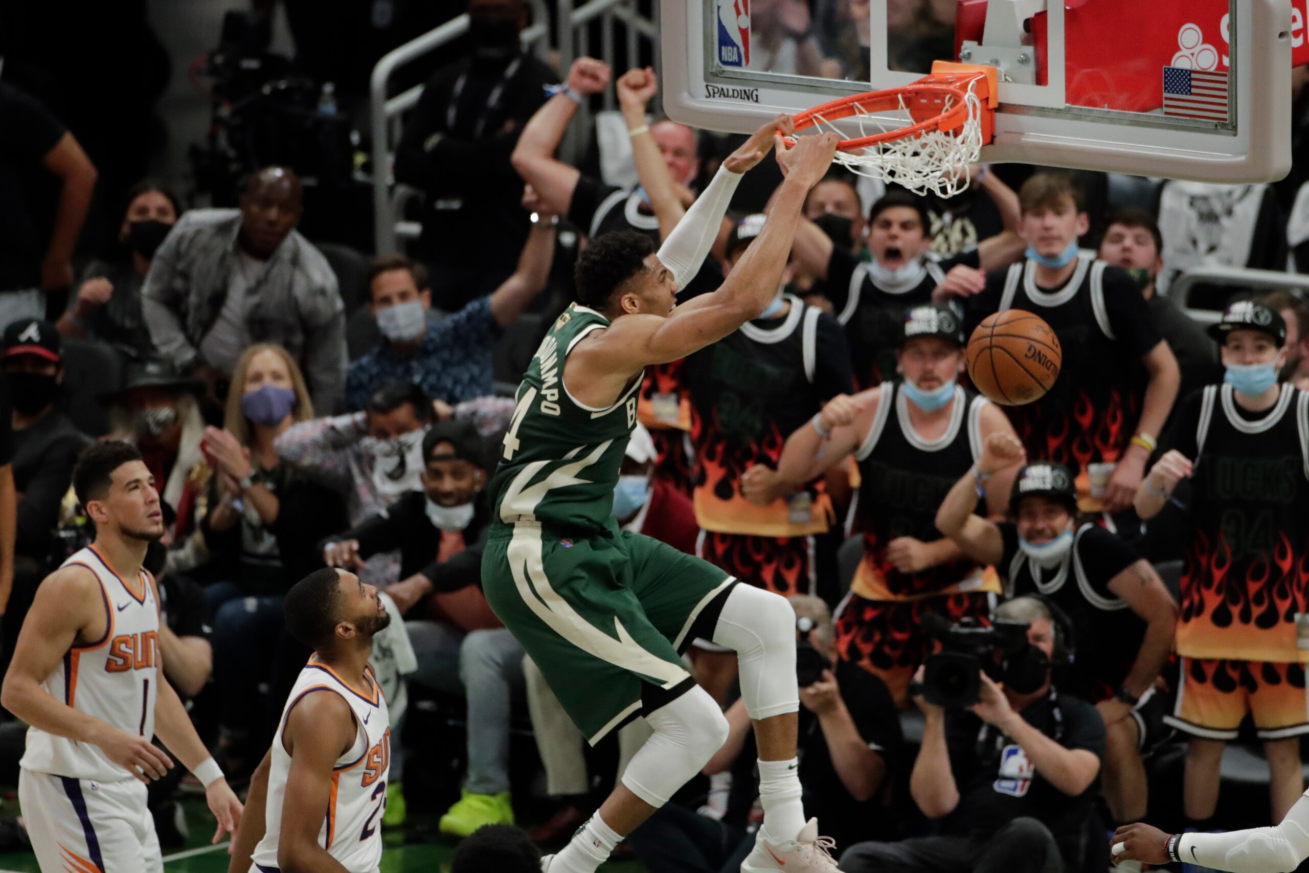 Milwaukee Bucks' Giannis Antetokounmpo (34) dunks during the first half of Game 3 of basketball's NBA Finals against the Phoenix Suns, Sunday, July 11, 2021, in Milwaukee. (AP Photo/Aaron Gash) Milwaukee Bucks' Giannis Antetokounmpo (34) dunks during the first half of Game 3 of basketball's NBA Finals against the Phoenix Suns, Sunday, July 11, 2021, in Milwaukee. (AP Photo/Aaron Gash)
