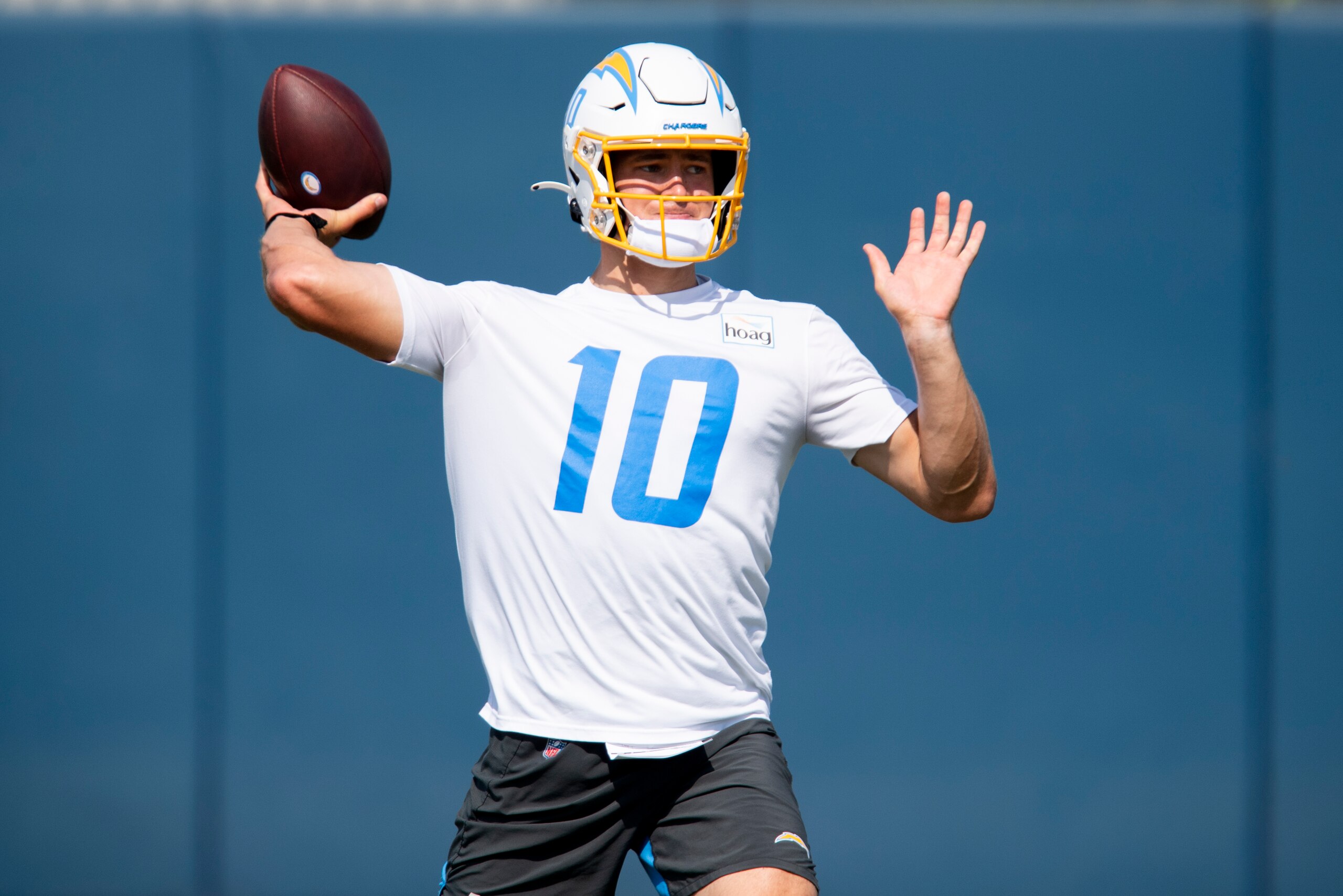 Los Angeles Chargers quarterback Justin Herbert (10) throws a pass during an NFL football practice Wednesday, June 16, 2021, in Costa Mesa, Calif. (AP Photo/Kyusung Gong)