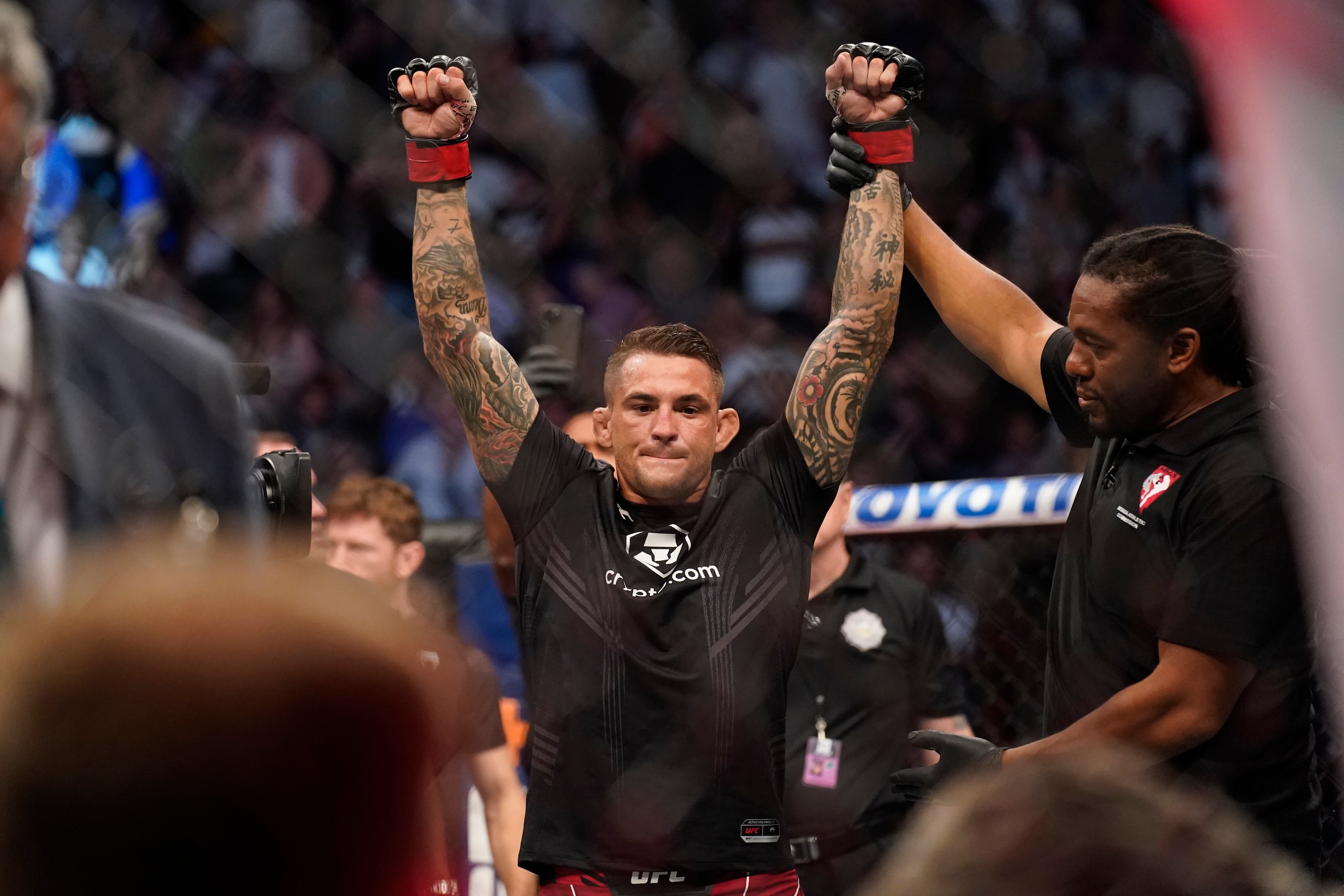 Dustin Poirier is declared the winner after Conor McGregor was injured during a UFC 264 lightweight mixed martial arts bout Saturday, July 10, 2021, in Las Vegas. (AP Photo/John Locher) Dustin Poirier is declared the winner after Conor McGregor was injured during a UFC 264 lightweight mixed martial arts bout Saturday, July 10, 2021, in Las Vegas. (AP Photo/John Locher)