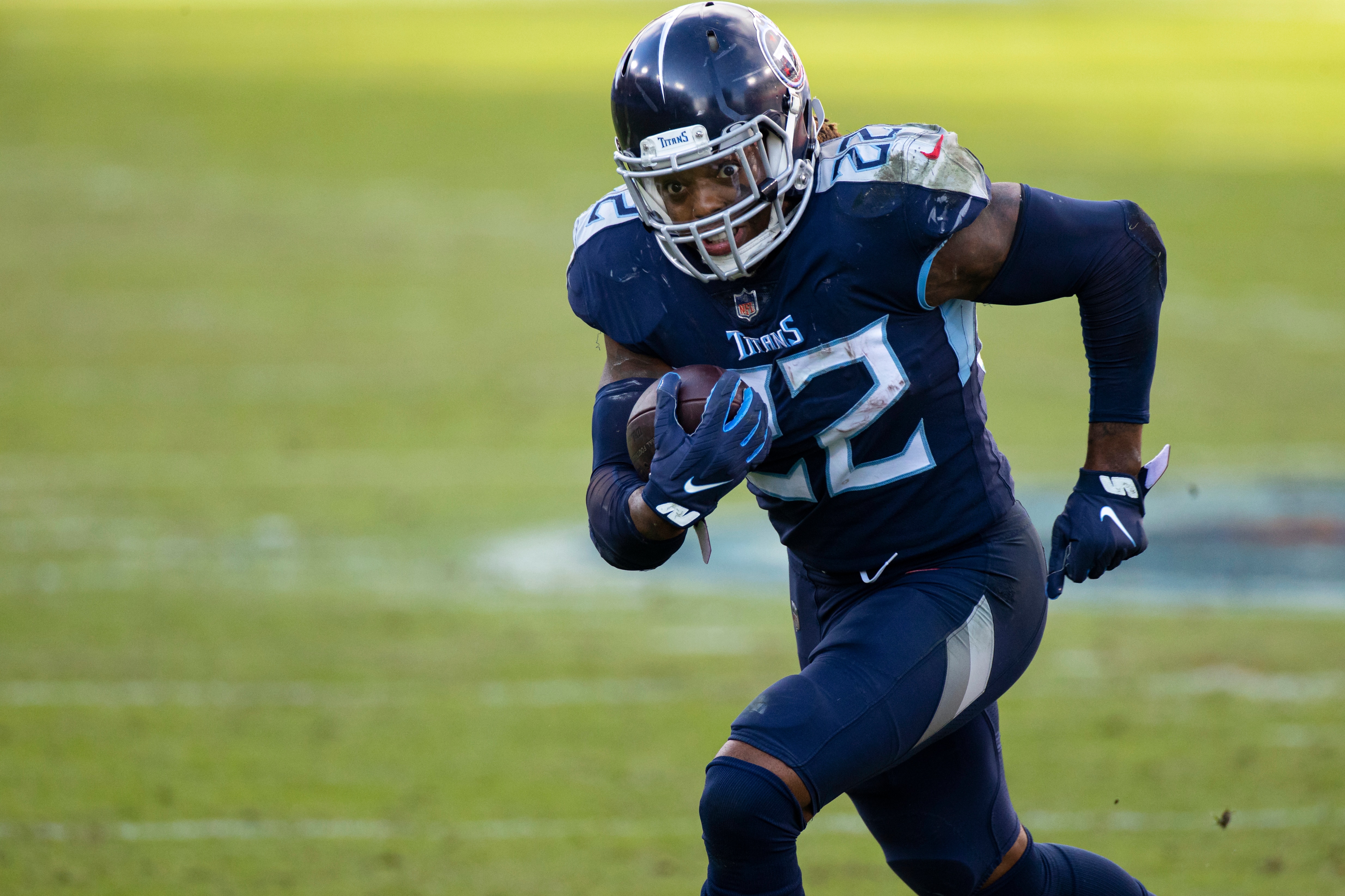 FILE - In this Dec. 20, 2020, file photo, Tennessee Titans running back Derrick Henry (22) carries ball against the Detroit Lions during the fourth quarter of an NFL football game in Nashville, Tenn. Henry as named The Associated Press Offensive Player of the Year on Saturday, Feb. 6, at the NFL Honors. (AP Photo/Brett Carlsen, File)