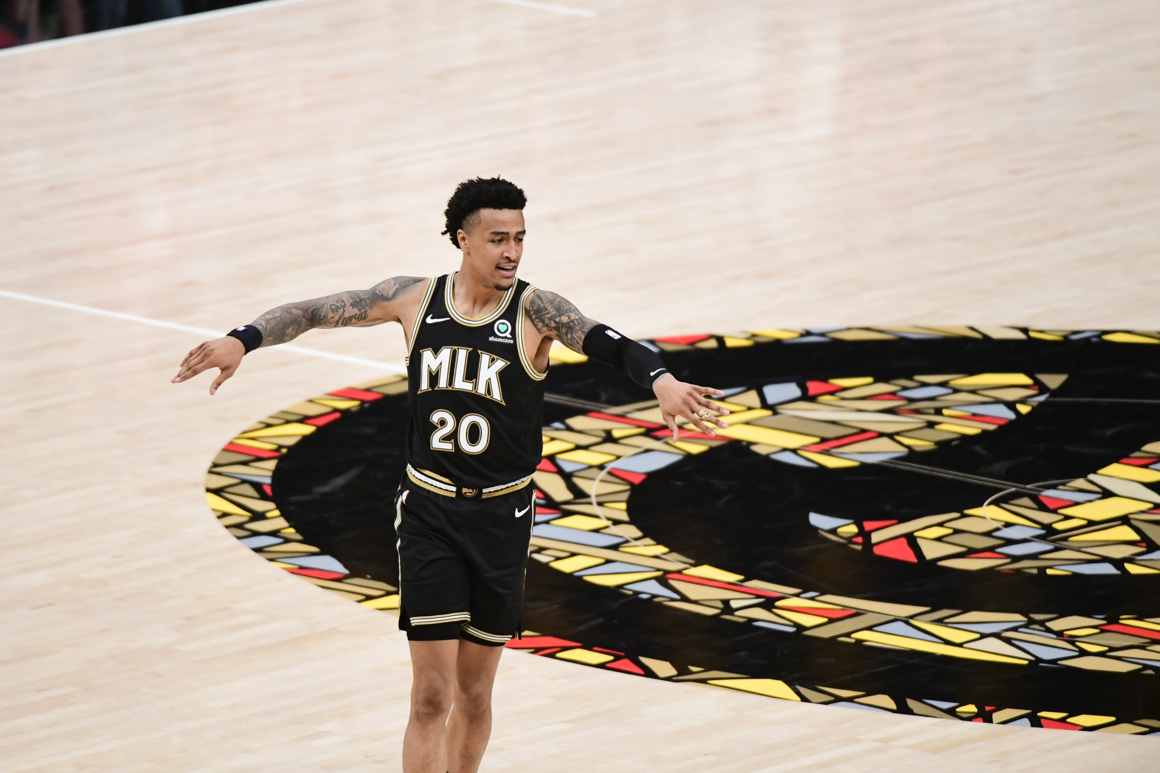 ATLANTA, GA - JULY 3: John Collins #20 of the Atlanta Hawks looks on during the game against the Milwaukee Bucks during Game 6 of the Eastern Conference Finals of the 2021 NBA Playoffs on July 3, 2021 at State Farm Arena in Atlanta, Georgia.  NOTE TO USER: User expressly acknowledges and agrees that, by downloading and/or using this Photograph, user is consenting to the terms and conditions of the Getty Images License Agreement. Mandatory Copyright Notice: Copyright 2021 NBAE (Photo by Adam Hagy/NBAE via Getty Images)