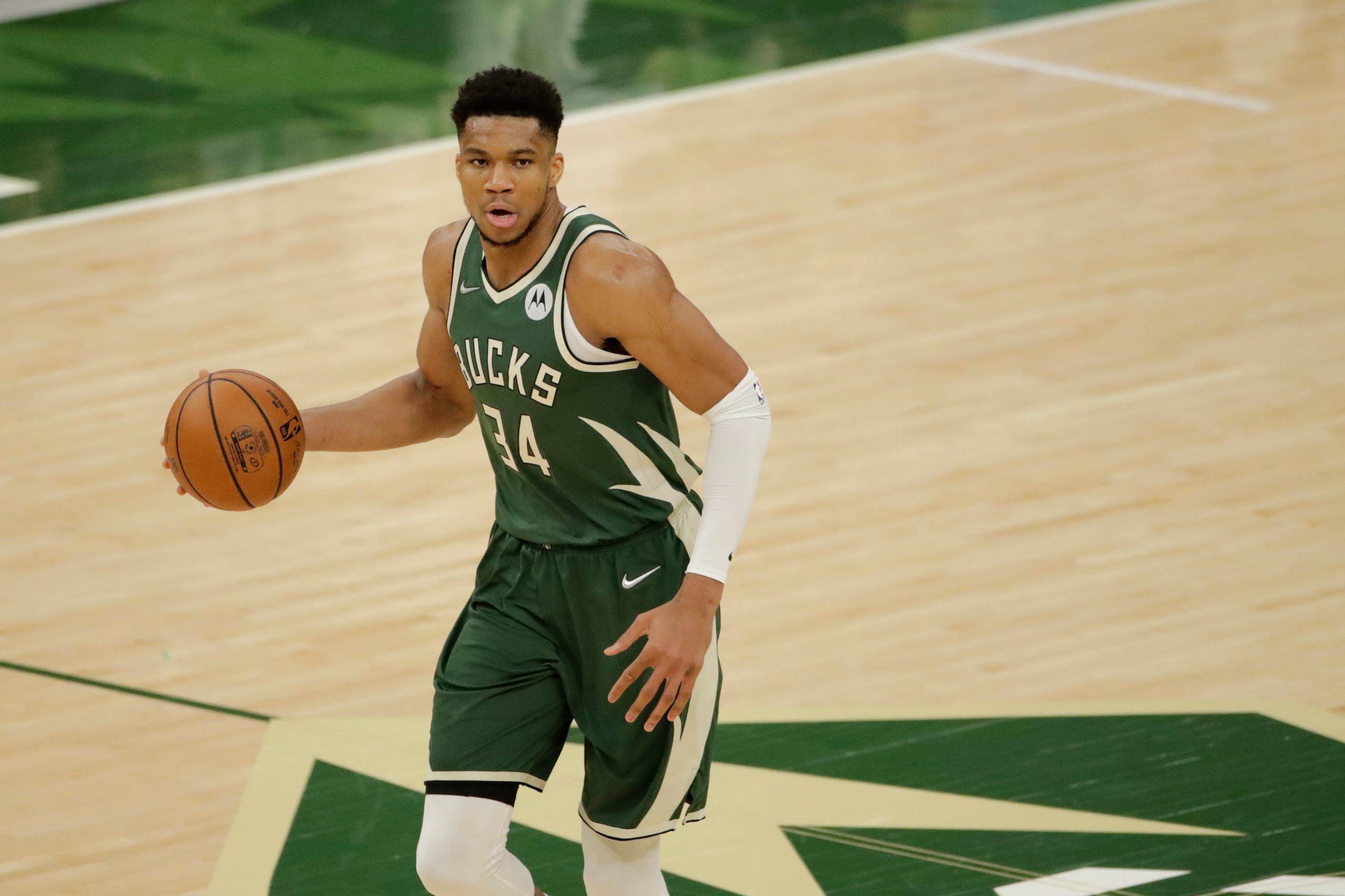 Milwaukee Bucks' Giannis Antetokounmpo dribbles during the second half of Game 3 of basketball's NBA Finals against the Phoenix Suns Sunday, July 11, 2021, in Milwaukee. (AP Photo/Aaron Gash)