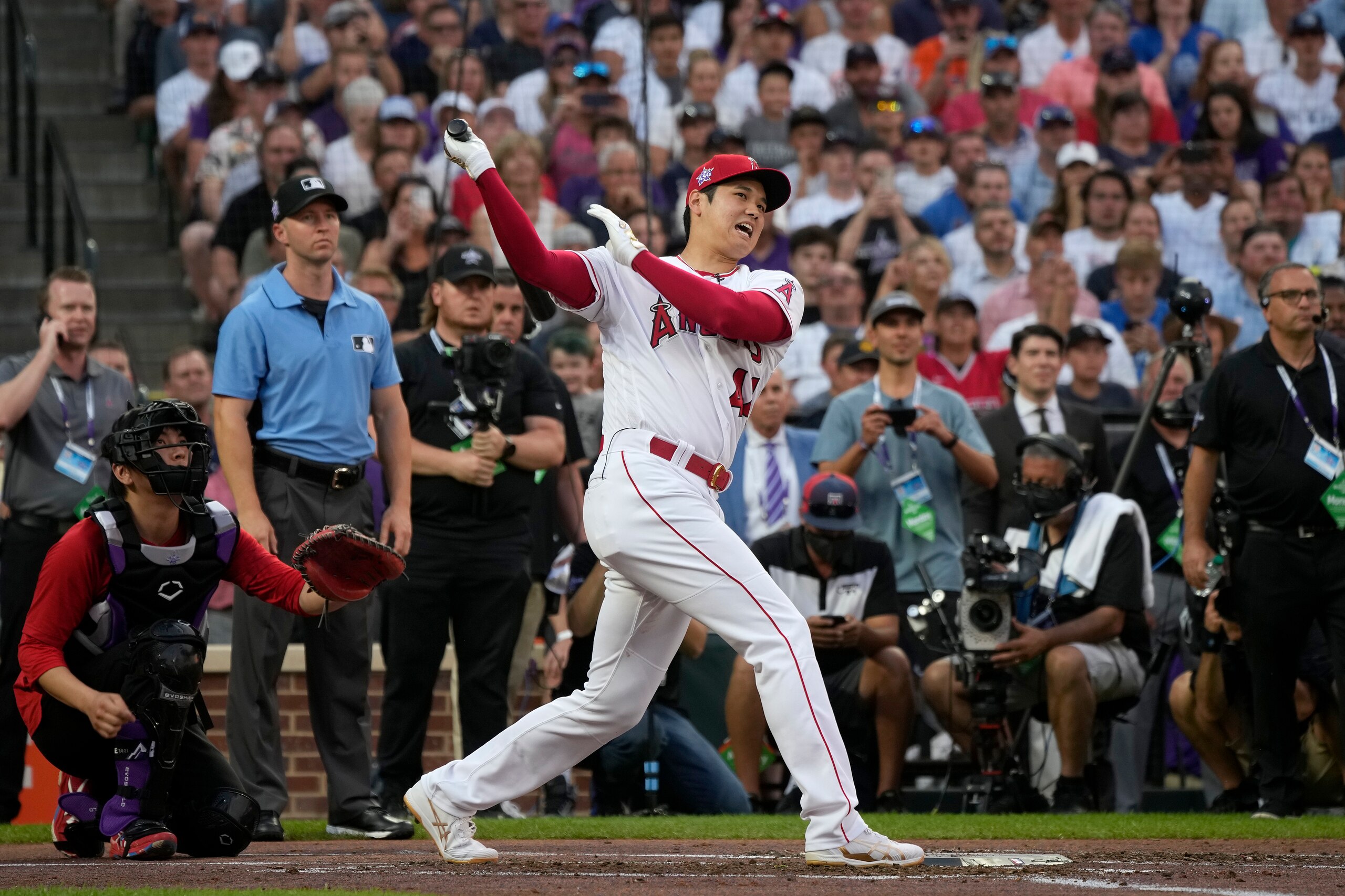 American League's Shohei Ohtani, of the Los Angeles Angeles, hits during the first round of the MLB All Star baseball Home Run Derby, Monday, July 12, 2021, in Denver. (AP Photo/David Zalubowski)