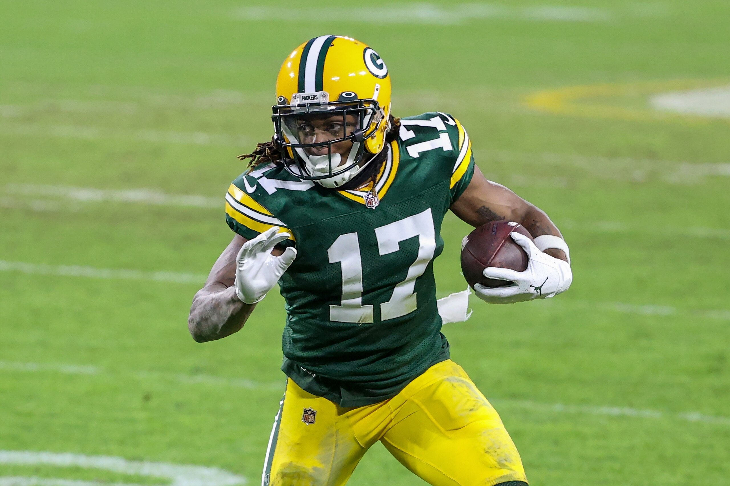 GREEN BAY, WISCONSIN - JANUARY 24: Davante Adams #17 of the Green Bay Packers runs with the ball in the fourth quarter against the Tampa Bay Buccaneers during the NFC Championship game at Lambeau Field on January 24, 2021 in Green Bay, Wisconsin. (Photo by Dylan Buell/Getty Images)