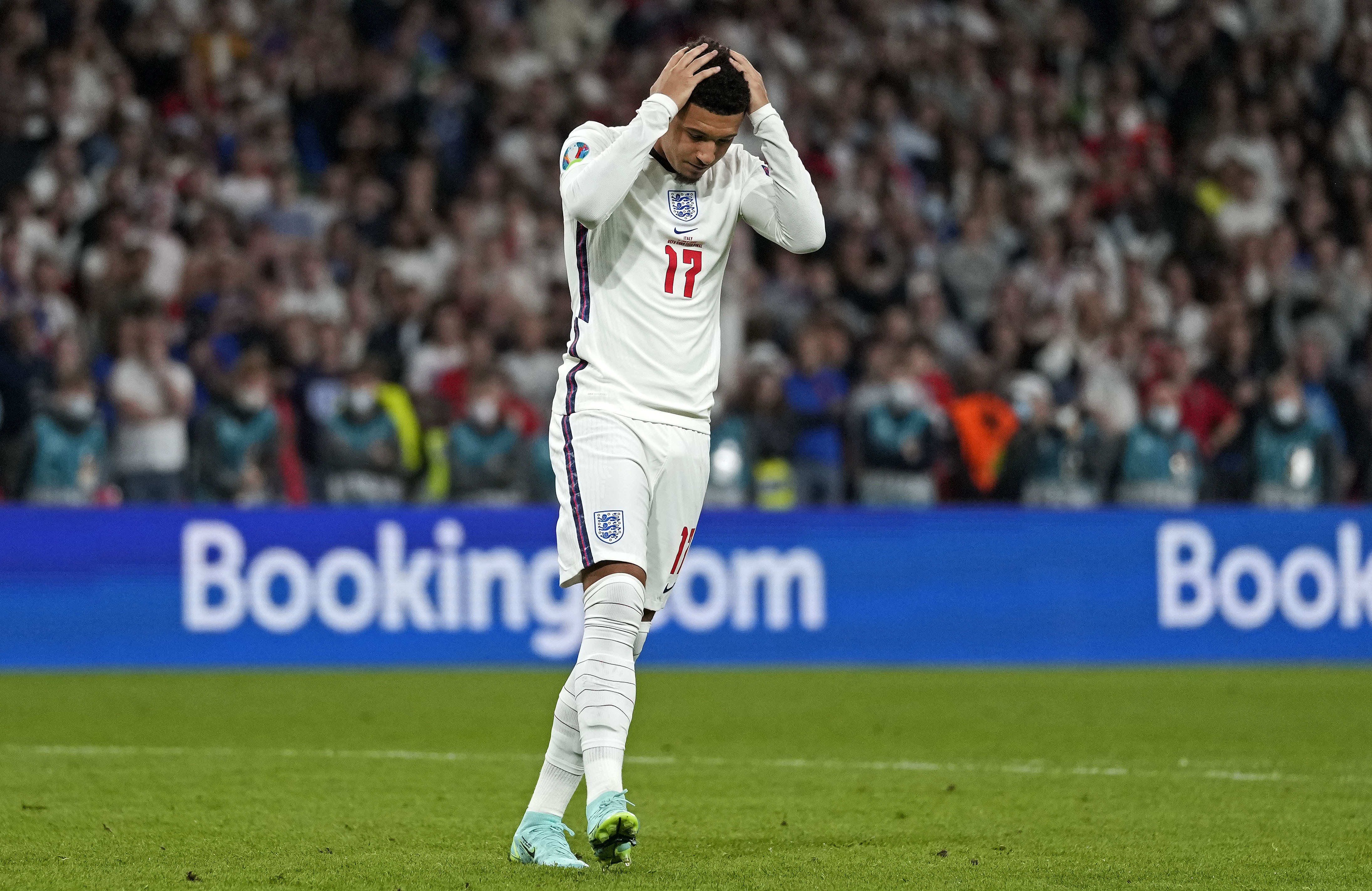 England's Jadon Sancho reacts after he missed to score during the penalty shootout of the Euro 2020 soccer championship final between England and Italy at Wembley stadium in London, Sunday, July 11, 2021. (AP Photo/Frank Augstein, Pool)