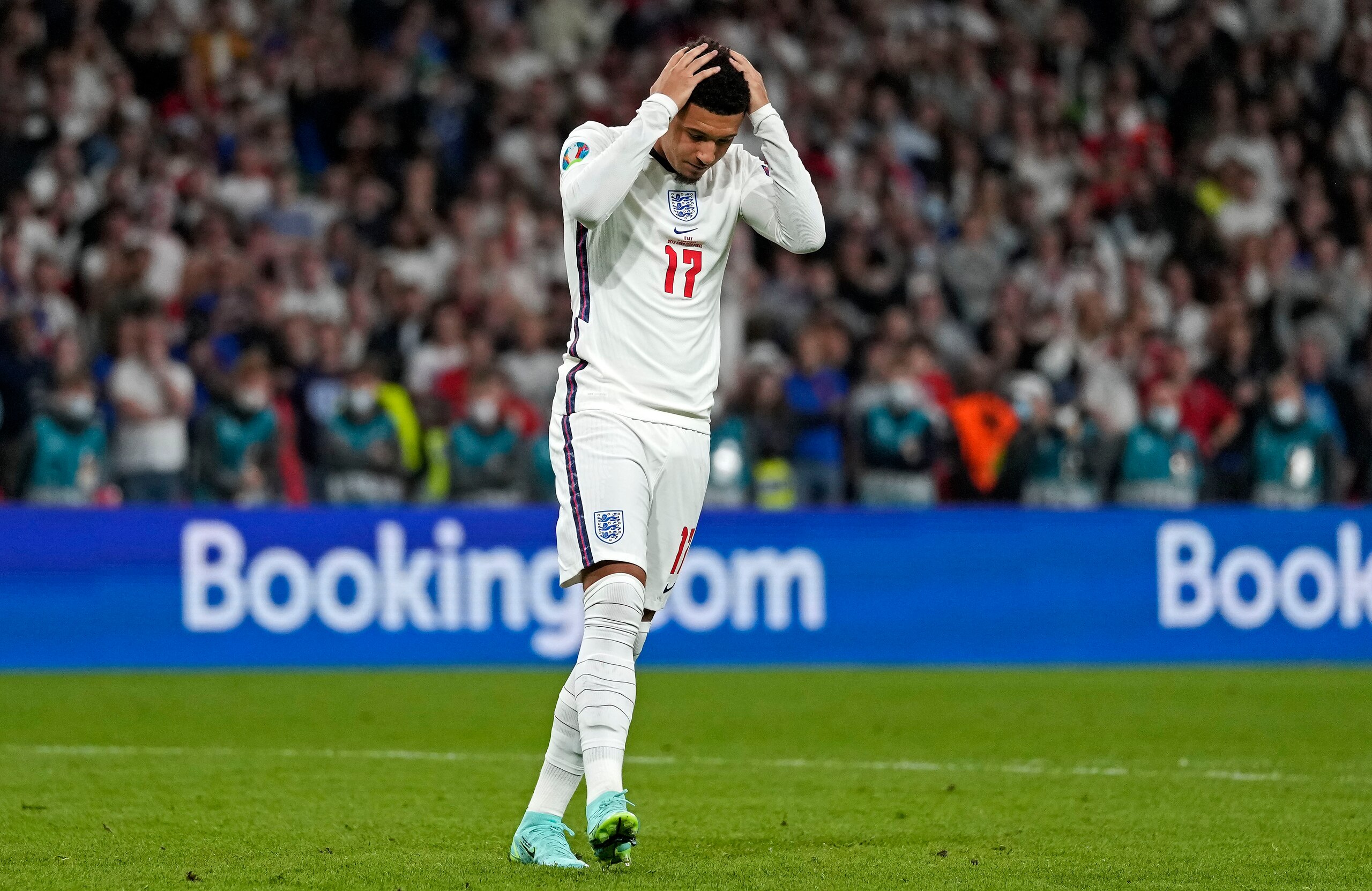 England's Jadon Sancho reacts after he missed to score during the penalty shootout of the Euro 2020 soccer championship final between England and Italy at Wembley stadium in London, Sunday, July 11, 2021. (AP Photo/Frank Augstein, Pool)