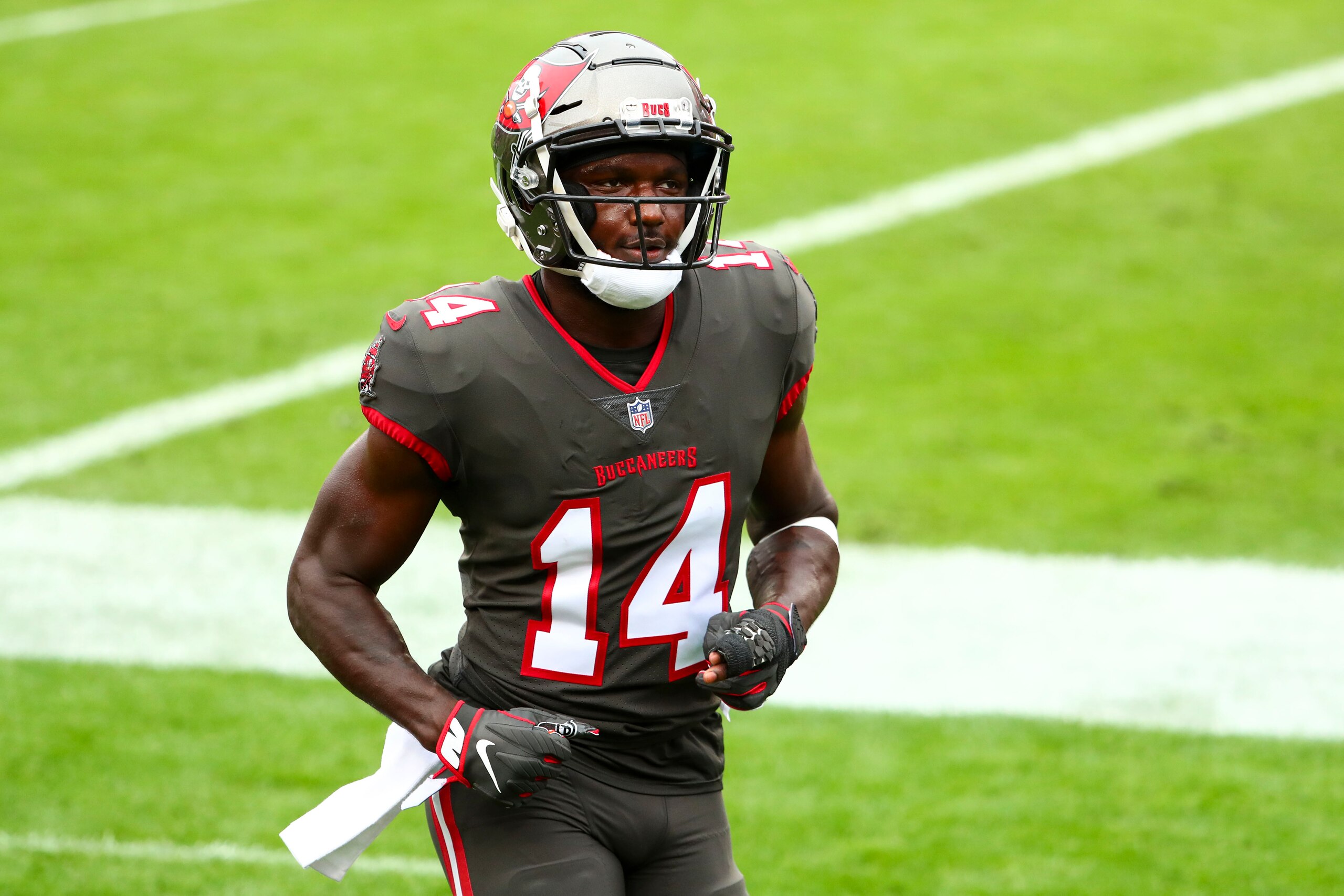 Tampa Bay Buccaneers wide receiver Chris Godwin (14) walks to the locker room prior to an NFL football game against the Atlanta Falcons, Sunday, Jan. 3, 2021, in Tampa, Fla. (AP Photo/Kevin Sabitus)