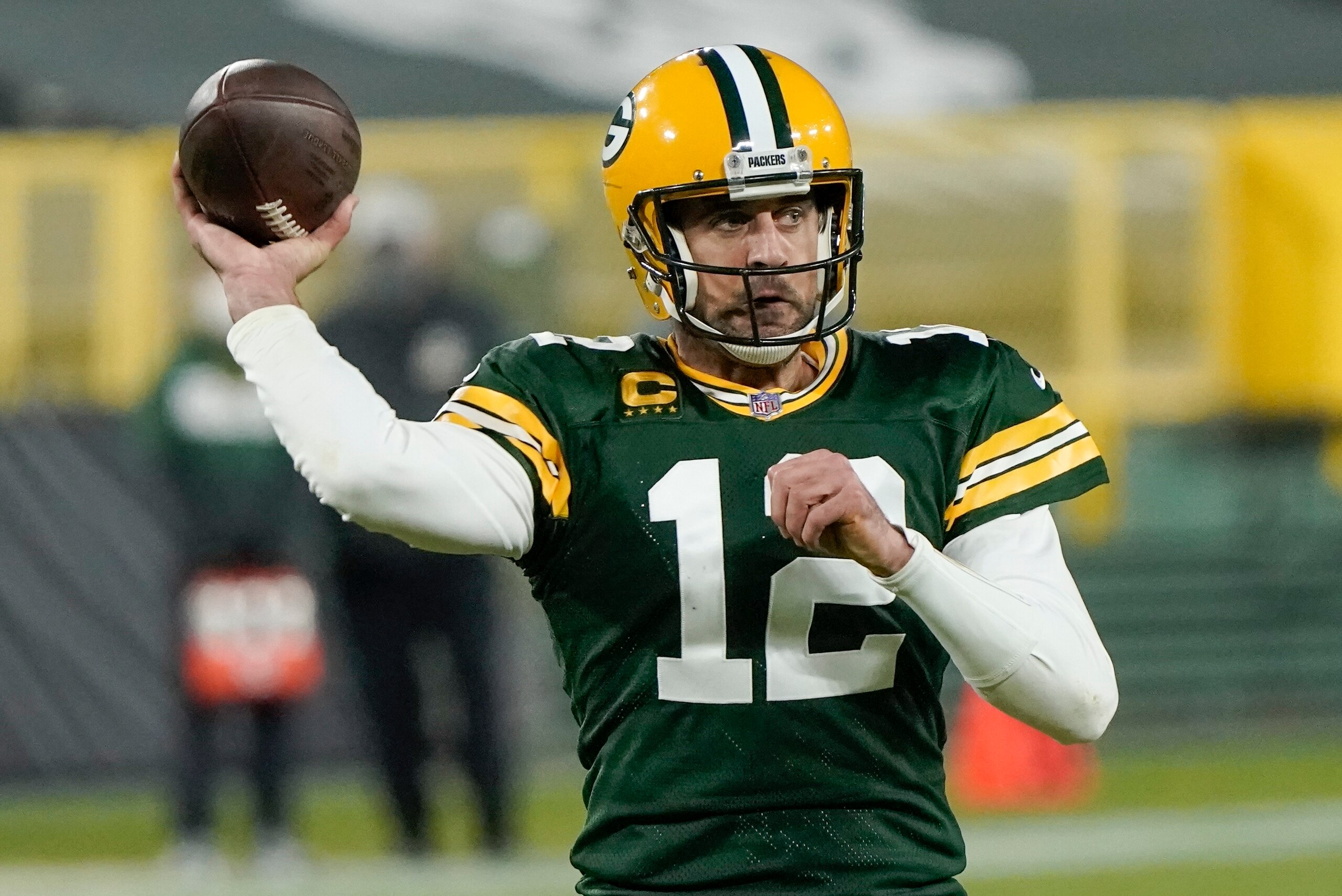 Green Bay Packers' Aaron Rodgers throws a touchdown pass during the second half of an NFL football game against the Philadelphia Eagles Sunday, Dec. 6, 2020, in Green Bay, Wis. (AP Photo/Morry Gash)