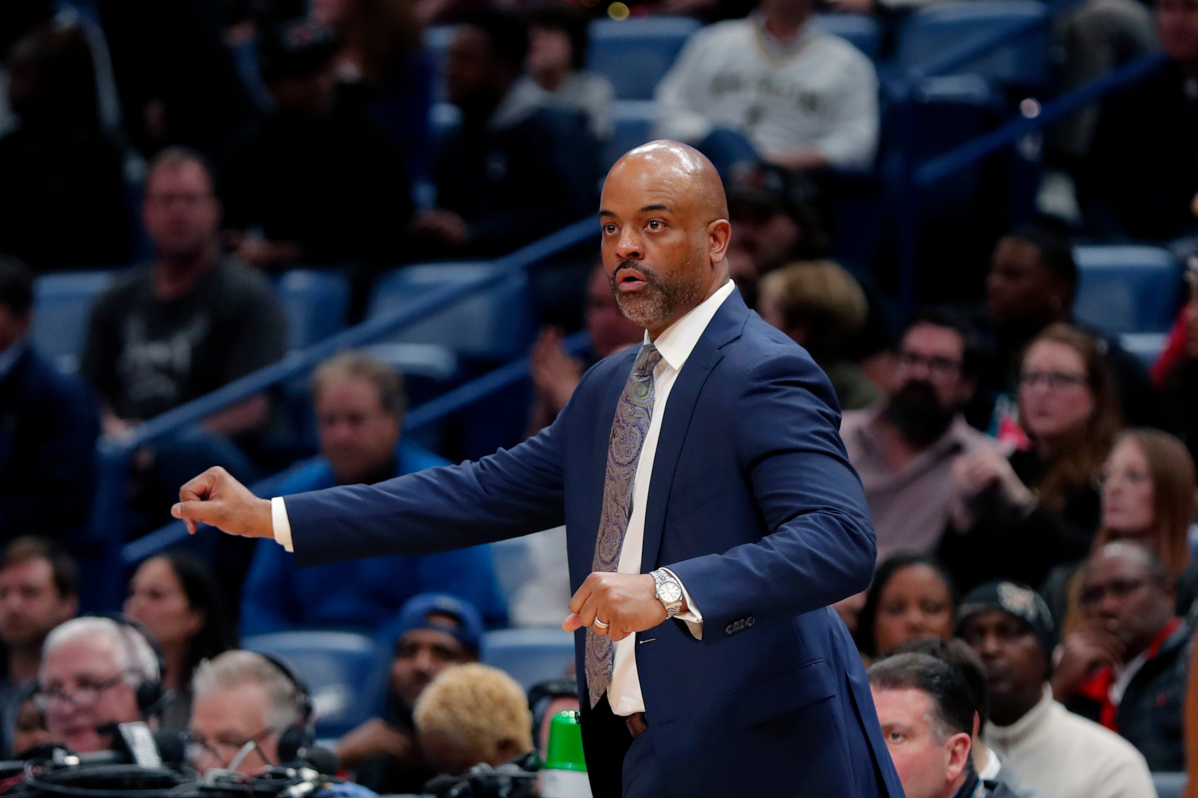 Denver Nuggets assistant coach Wes Unseld, Jr. calls out from the bench after taking over head coaching duties, following the ejection of head coach Michael Malone, in the second half of an NBA basketball game against the New Orleans Pelicans in New Orleans, Friday, Jan. 24, 2020. the Nuggets won 113-106. (AP Photo/Gerald Herbert)