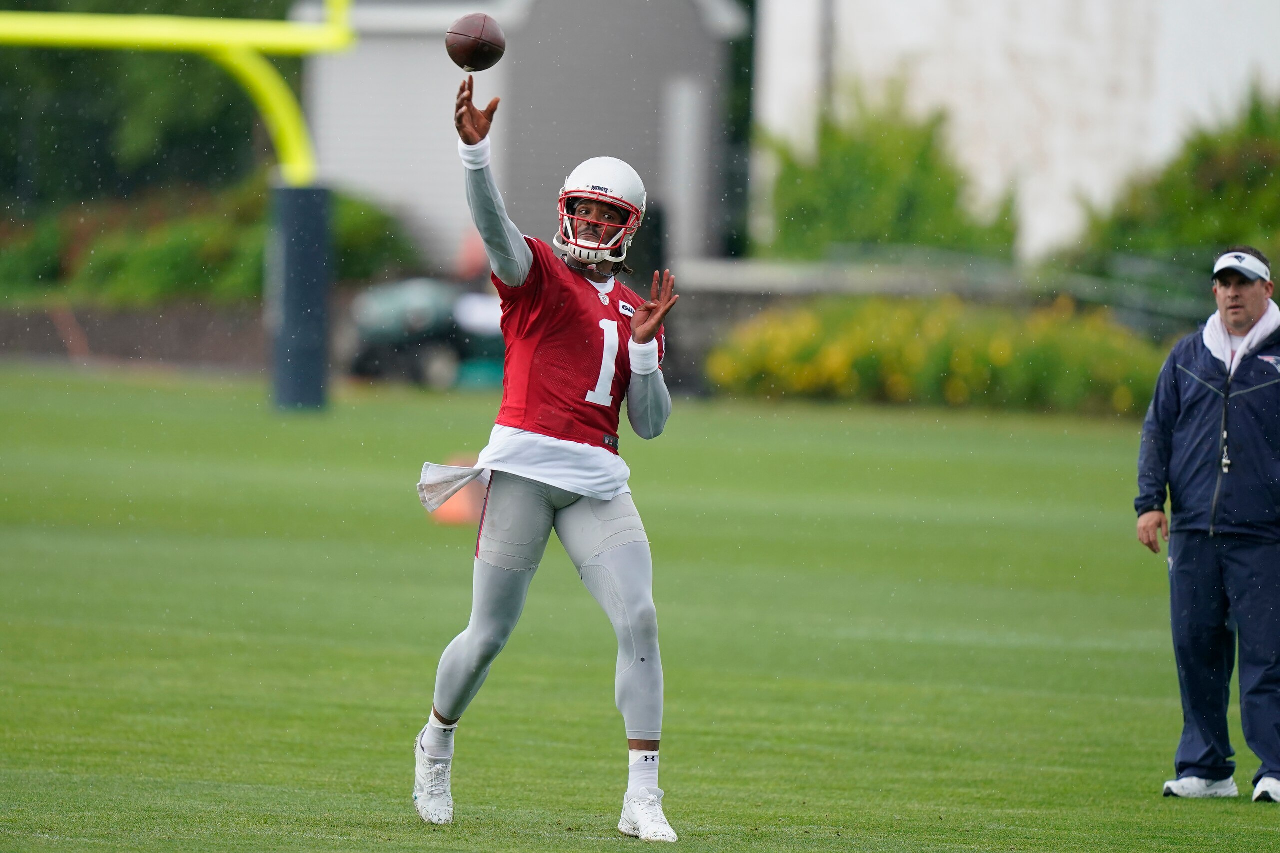 New England Patriots quarterback Cam Newton (1) passes the ball during an NFL football practice, Monday, June 14, 2021, in Foxborough, Mass. (AP Photo/Steven Senne)