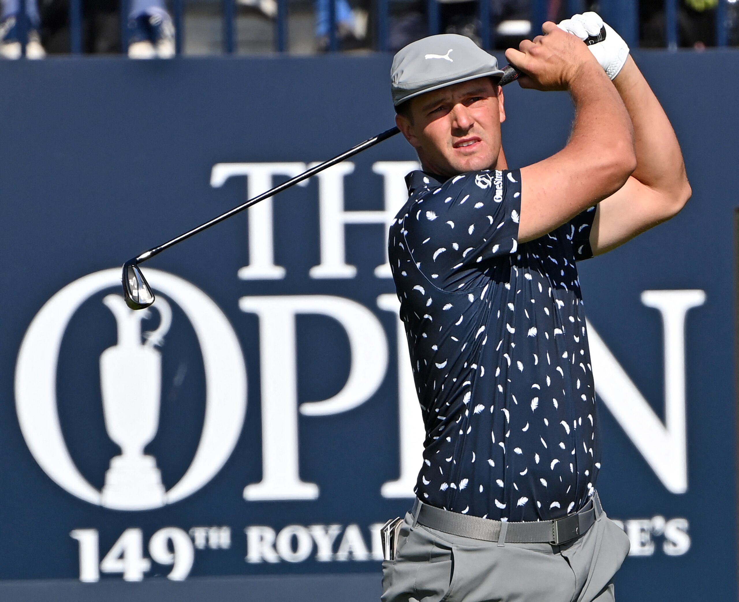 US golfer Bryson DeChambeau watches his iron shot from the 1st tee during his first round on day one of The 149th British Open Golf Championship at Royal St George's, Sandwich in south-east England on July 15, 2021. - RESTRICTED TO EDITORIAL USE (Photo by Paul ELLIS / AFP) / RESTRICTED TO EDITORIAL USE (Photo by PAUL ELLIS/AFP via Getty Images)