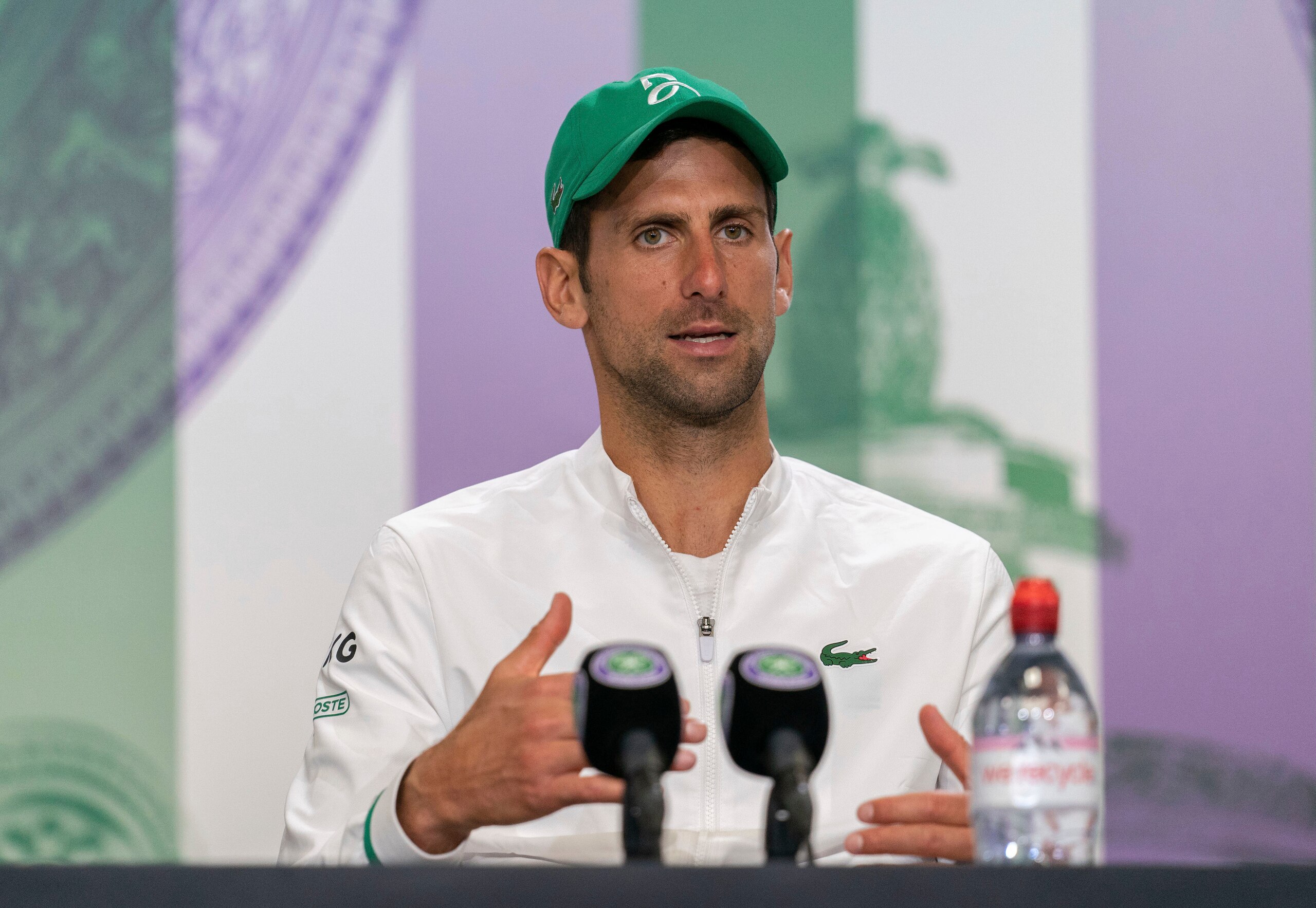 Novak Djokovic attends a press conference after winning the men's final against Italy's Matteo Berrettini at the Wimbledon Tennis Championships in London, Sunday, July 11, 2021. (Joe Toth/Pool via AP)