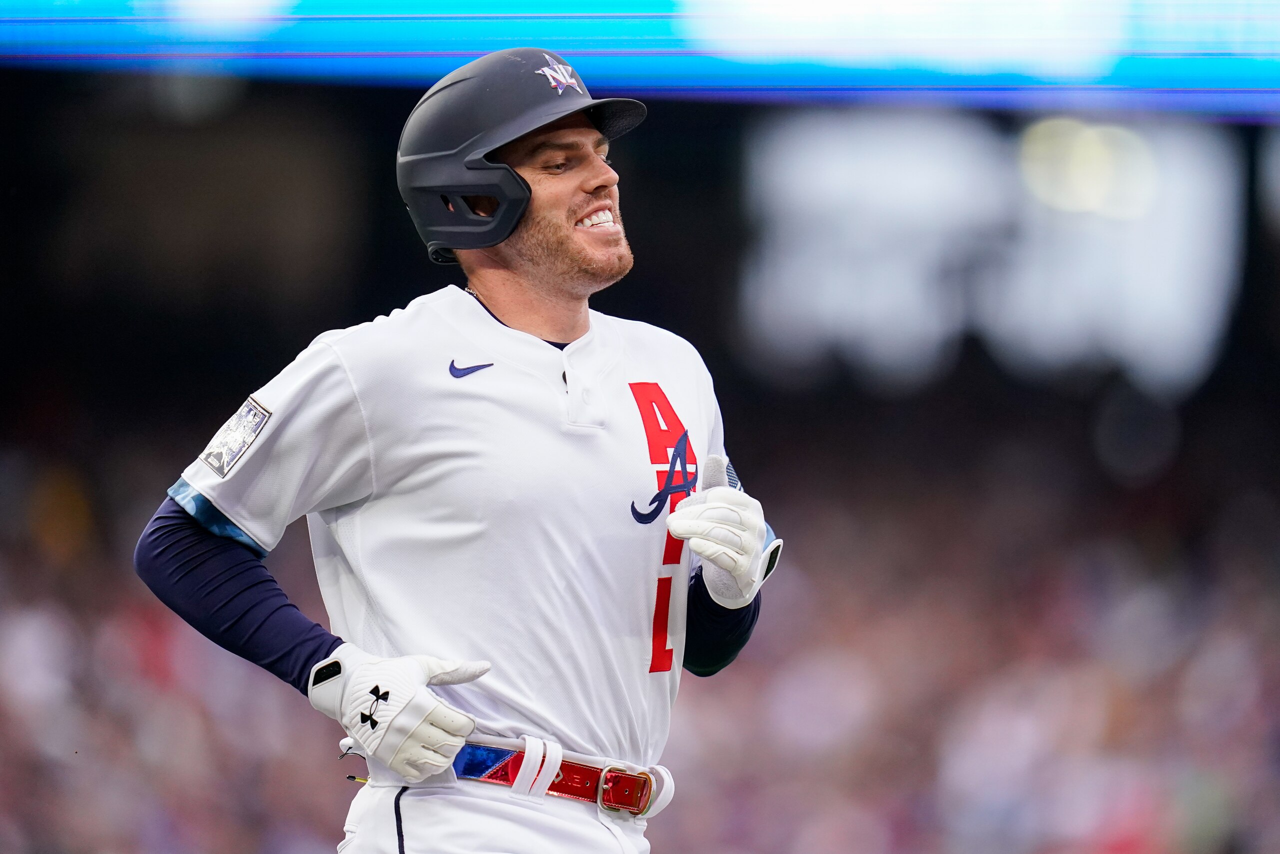 DENVER, COLORADO - JULY 13: National League All-Star Freddie Freeman #5 of the Atlanta Braves smiles while running to first against the American League during the 91st MLB All-Star Game presented by Mastercard at Coors Field on July 13, 2021 in Denver, Colorado. (Photo by Matt Dirksen/Colorado Rockies/Getty Images)