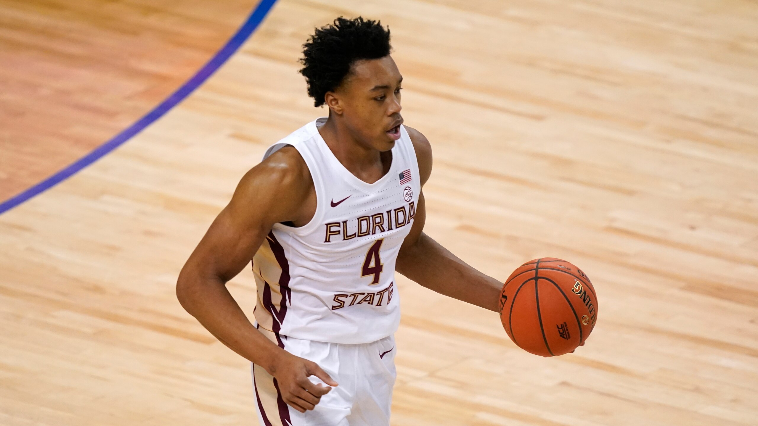 Florida State guard Scottie Barnes (4) drives down court during the first half of an NCAA college basketball Championship game against Georgia Tech at the Atlantic Coast Conference tournament in Greensboro, N.C., Saturday, March 13, 2021. (AP Photo/Gerry Broome)