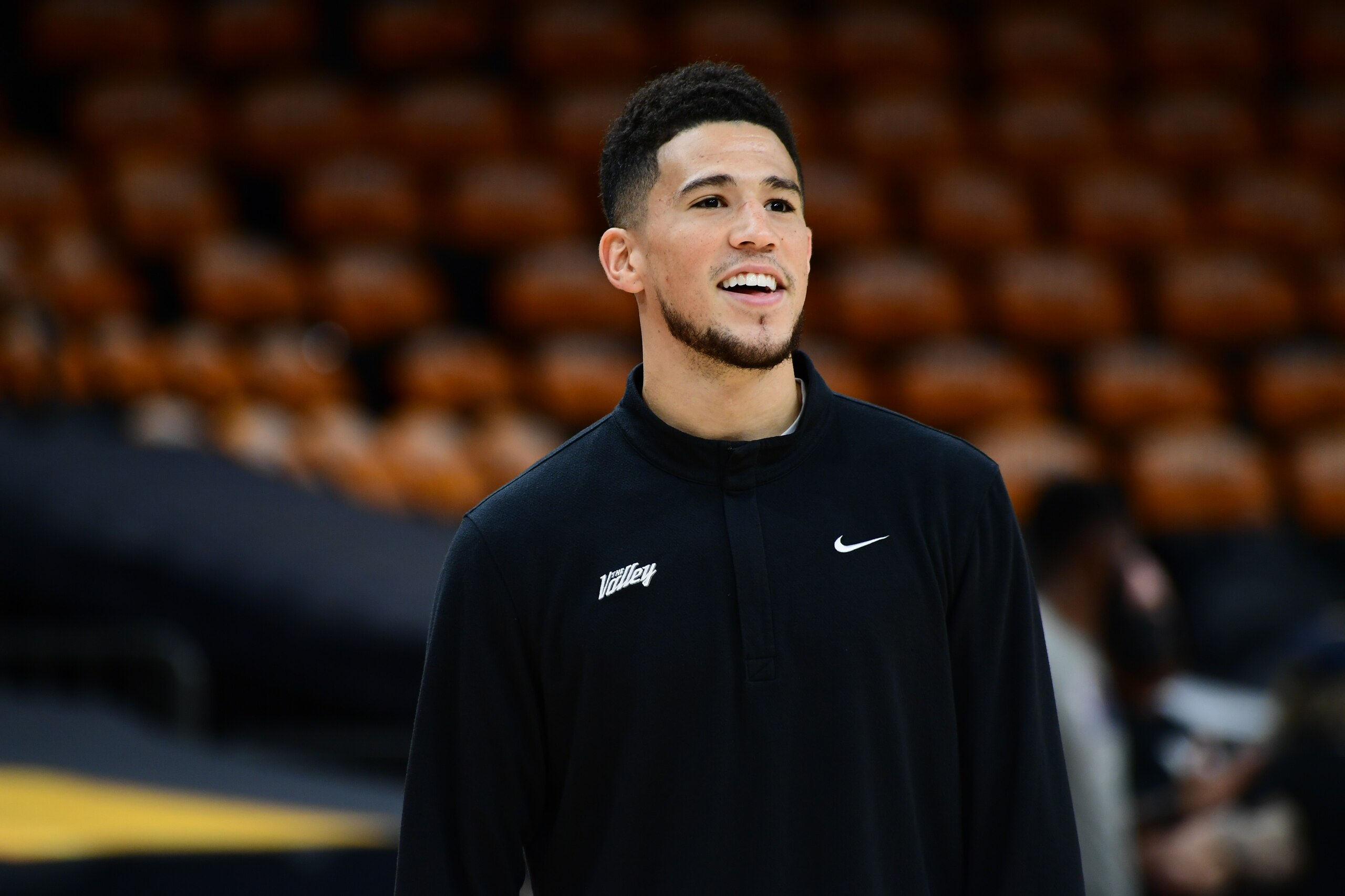 PHOENIX, AZ - JULY 16:  Devin Booker #1 of the Phoenix Suns looks on during practice and media availability as part of the 2021 NBA Finals on July 16, 2021 at Footprint Center in Phoenix, Arizona. NOTE TO USER: User expressly acknowledges and agrees that, by downloading and or using this photograph, user is consenting to the terms and conditions of Getty Images License Agreement. Mandatory Copyright Notice: Copyright 2021 NBAE (Photo by Michael Gonzales/NBAE via Getty Images)