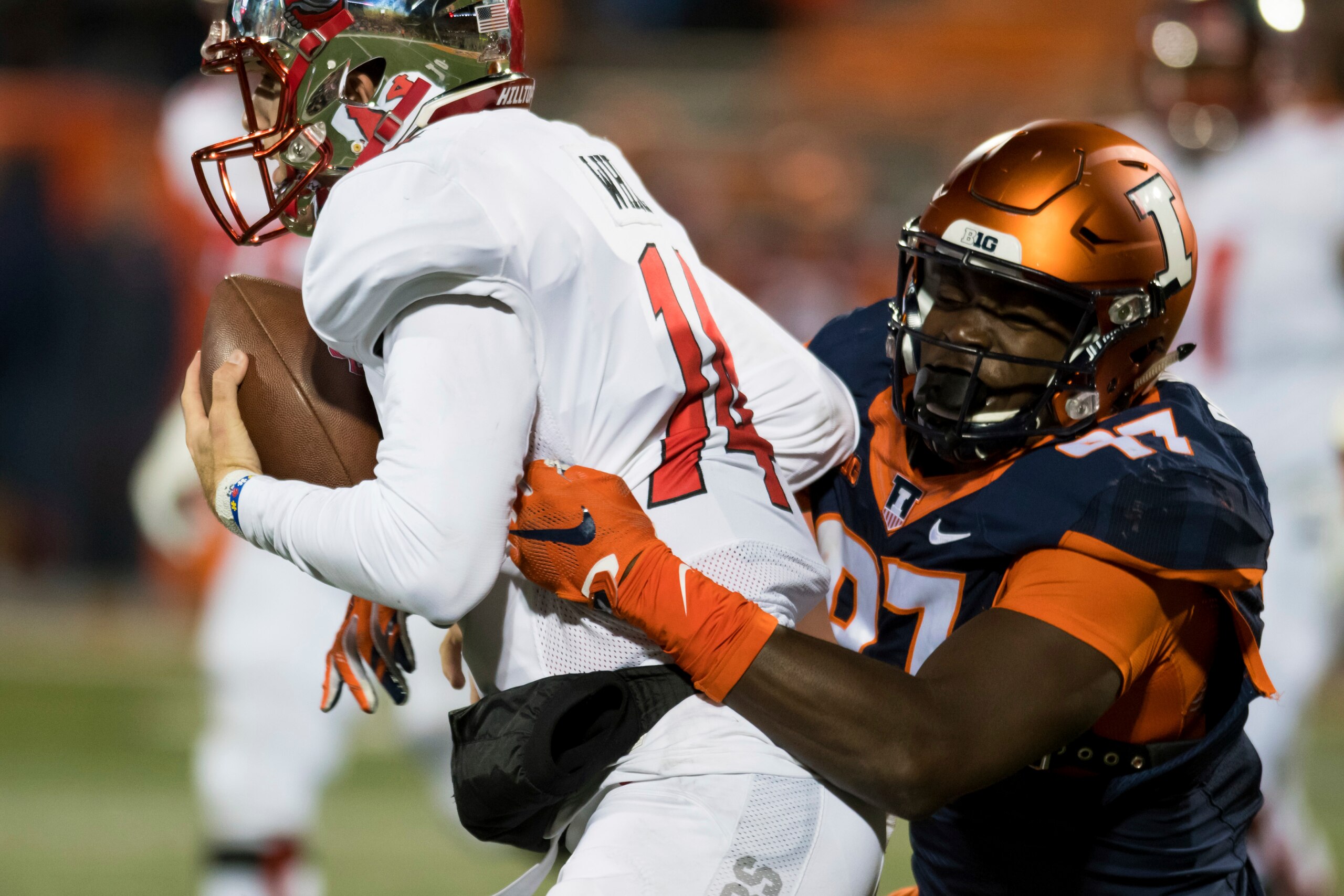 Illinois defensive lineman Bobby Roundtree (97) sacks Western Kentucky quarterback Mike White during the fourth quarter of an NCAA college football game Saturday, Sept. 9, 2017, in Champaign, Ill. Illinois won 20-7. (AP Photo/Bradley Leeb)